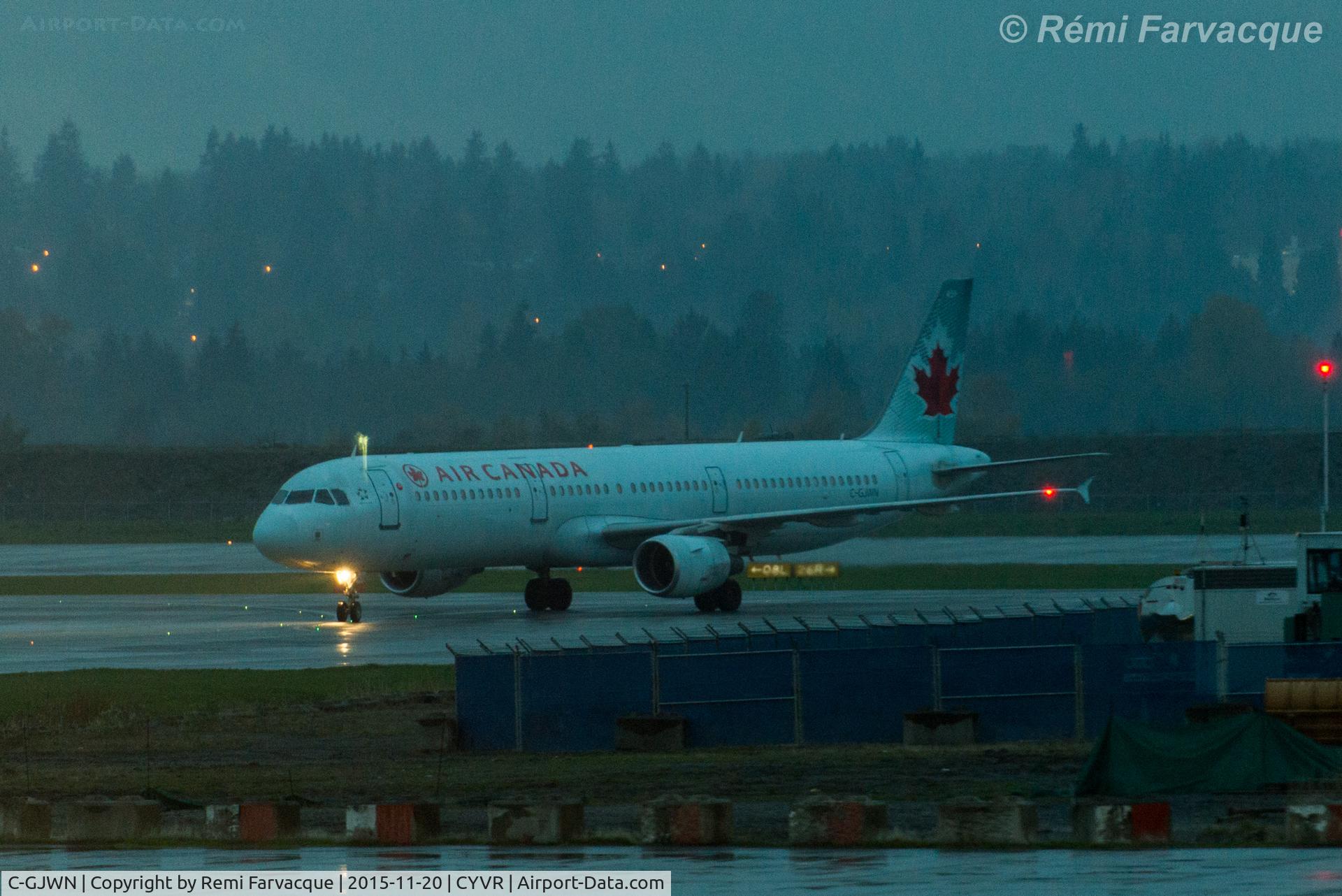 C-GJWN, 2002 Airbus A321-211 C/N 1783, Taxiing to domestic after landing westerly on north runway.