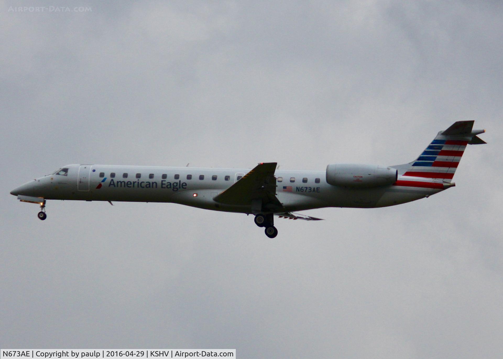 N673AE, 2004 Embraer ERJ-145LR (EMB-145LR) C/N 145797, At Shreveport Regional. Landing in the pouring rain.