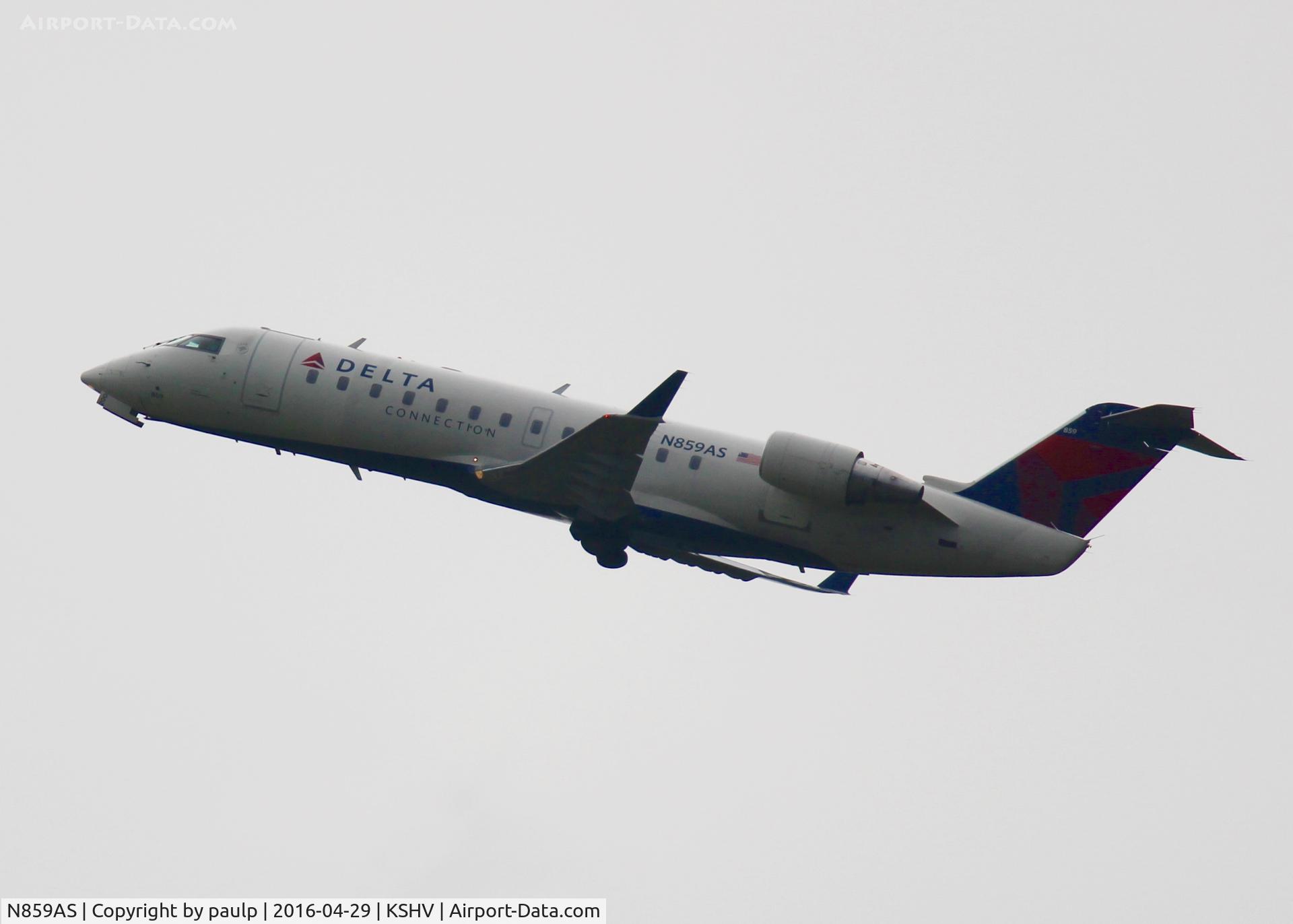 N859AS, 2000 Bombardier CRJ-200ER (CL-600-2B19) C/N 7421, At Shreveport Regional. Taking off in the pouring rain.