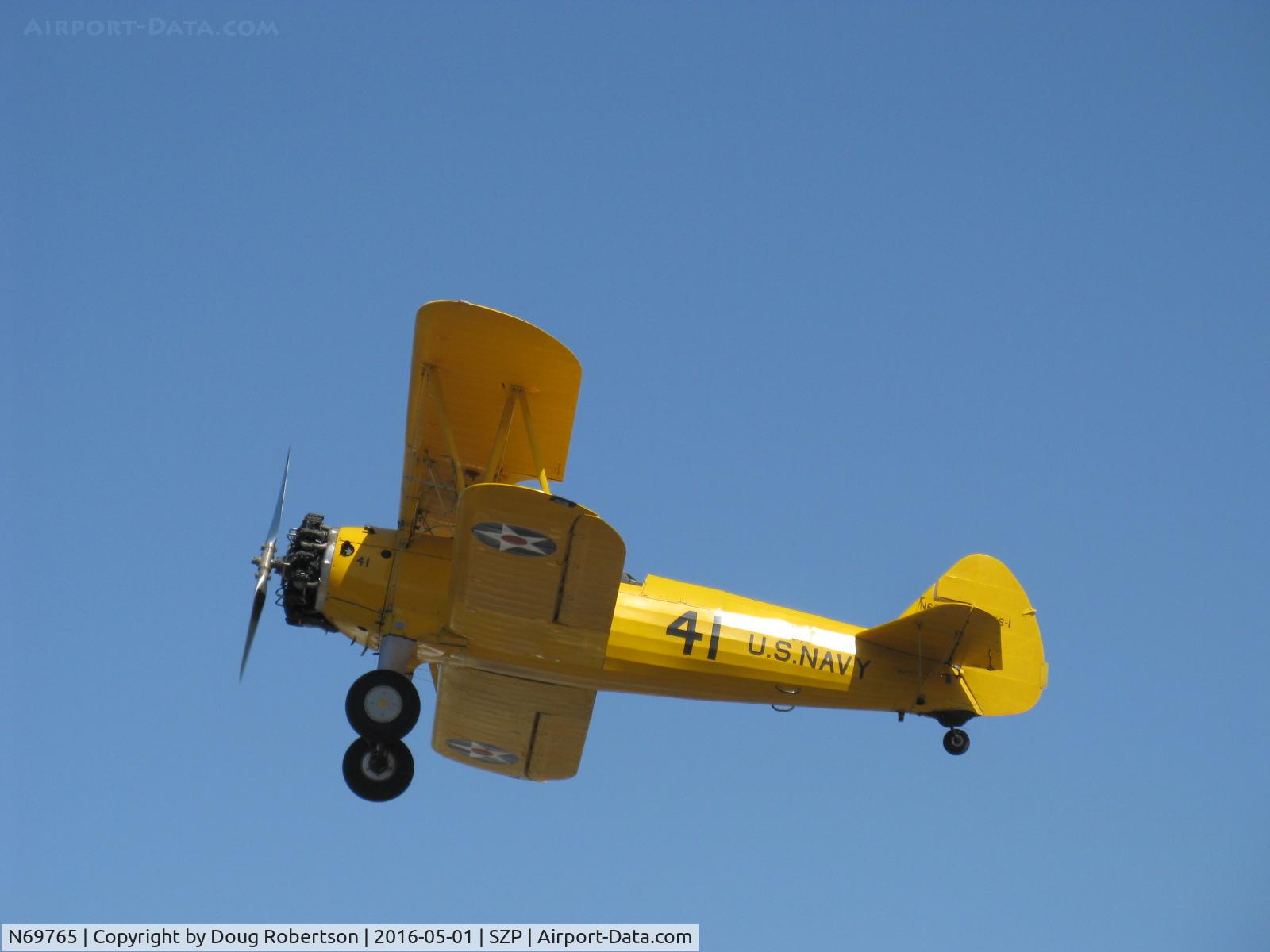 N69765, 1941 Boeing A75N1 (PT17) C/N 75-1044, 1941 Boeing Stearman A75N1 as Navy N2S-1, Continental W670 220 Hp radial, takeoff climb Rwy 22
