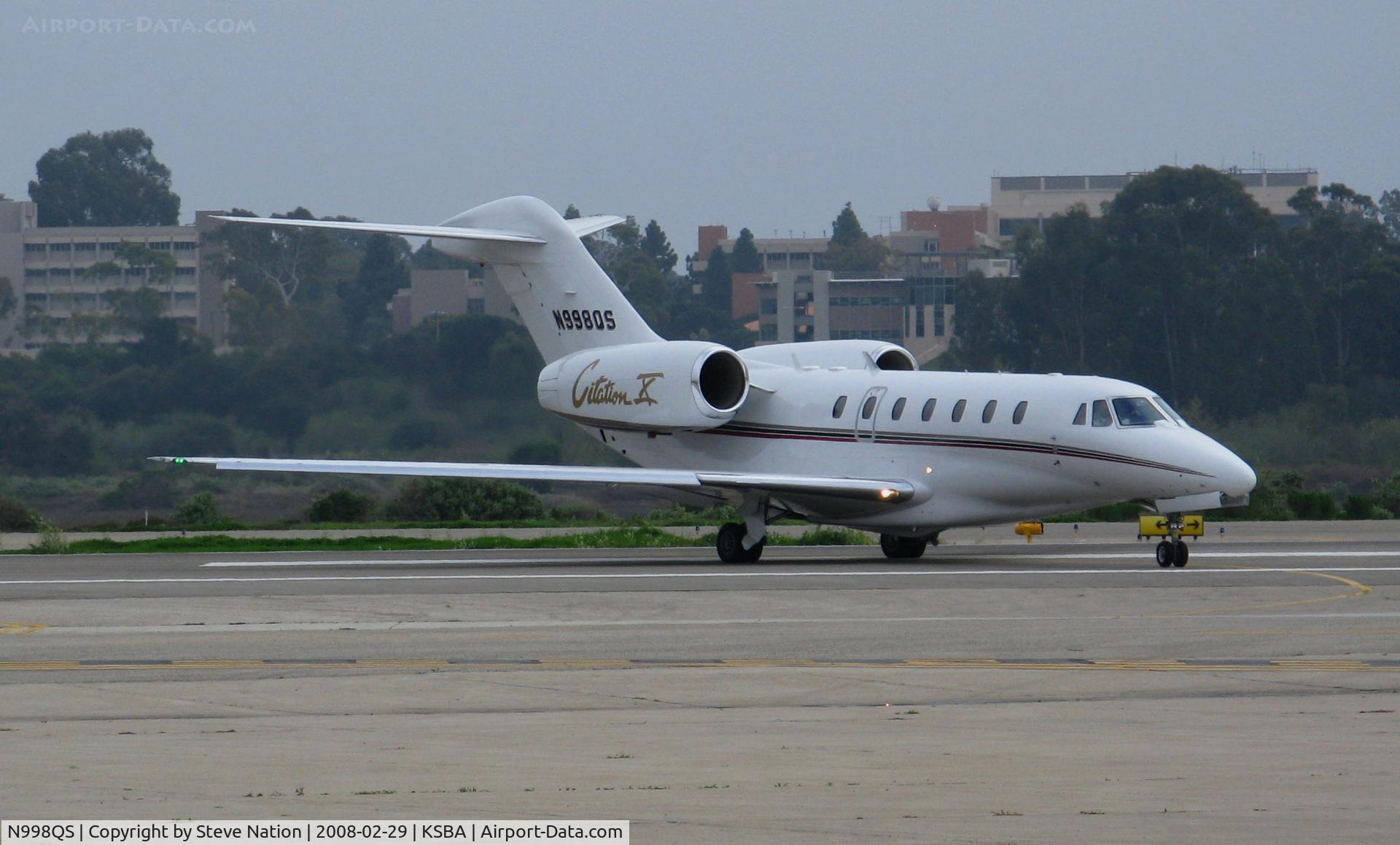 N998QS, 2002 Cessna 750 Citation X Citation X C/N 750-0198, NetJets 2002 Cessna 750 taxiing with UCSB campus in background @ Santa Barbara Municipal Airport, CA