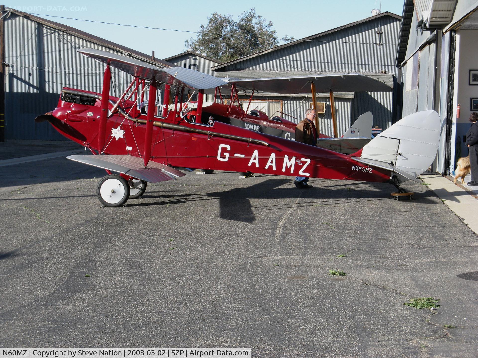 N60MZ, 1930 De Havilland DH-60G Gypsy Moth C/N 1293, Locally-based 1930 deHavilland DH-60G Gypsy Moth in red and silver color scheme and carrying U.S. and British registrations (NX60MZ and G-AAMZ) @ Santa Paula Airport, CA
