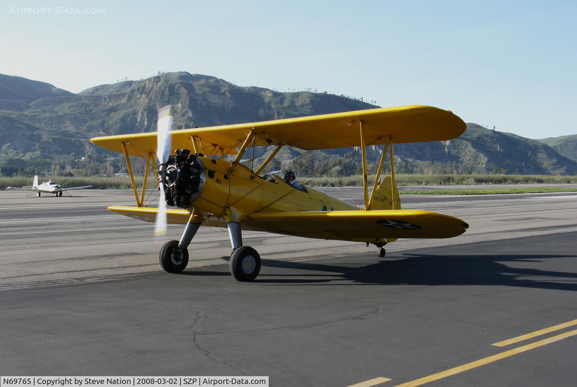 N69765, 1941 Boeing A75N1 (PT17) C/N 75-1044, Locally-based 1941 Boeing N2S-1 Stearman (c/n 75-1044) painted in yellow as Navy 41 @ Santa Paula Airport, CA back from an early Sunday morning circuit around the field