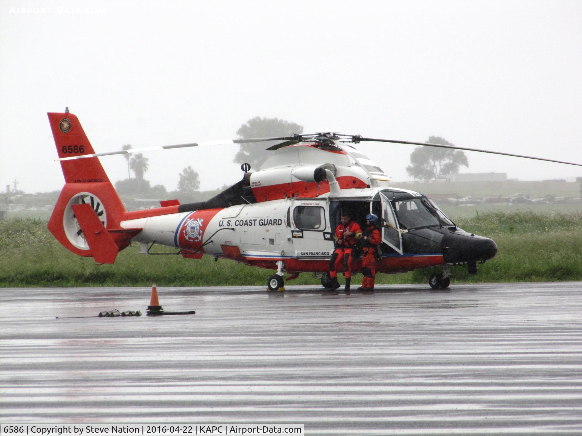 6586, Aerospatiale MH-65D Dolphin C/N 6285, USCG Aerospatiale HH-65C from CGAS San Francisco, CA with crew stretching their legs @ Napa County Airport, CA
