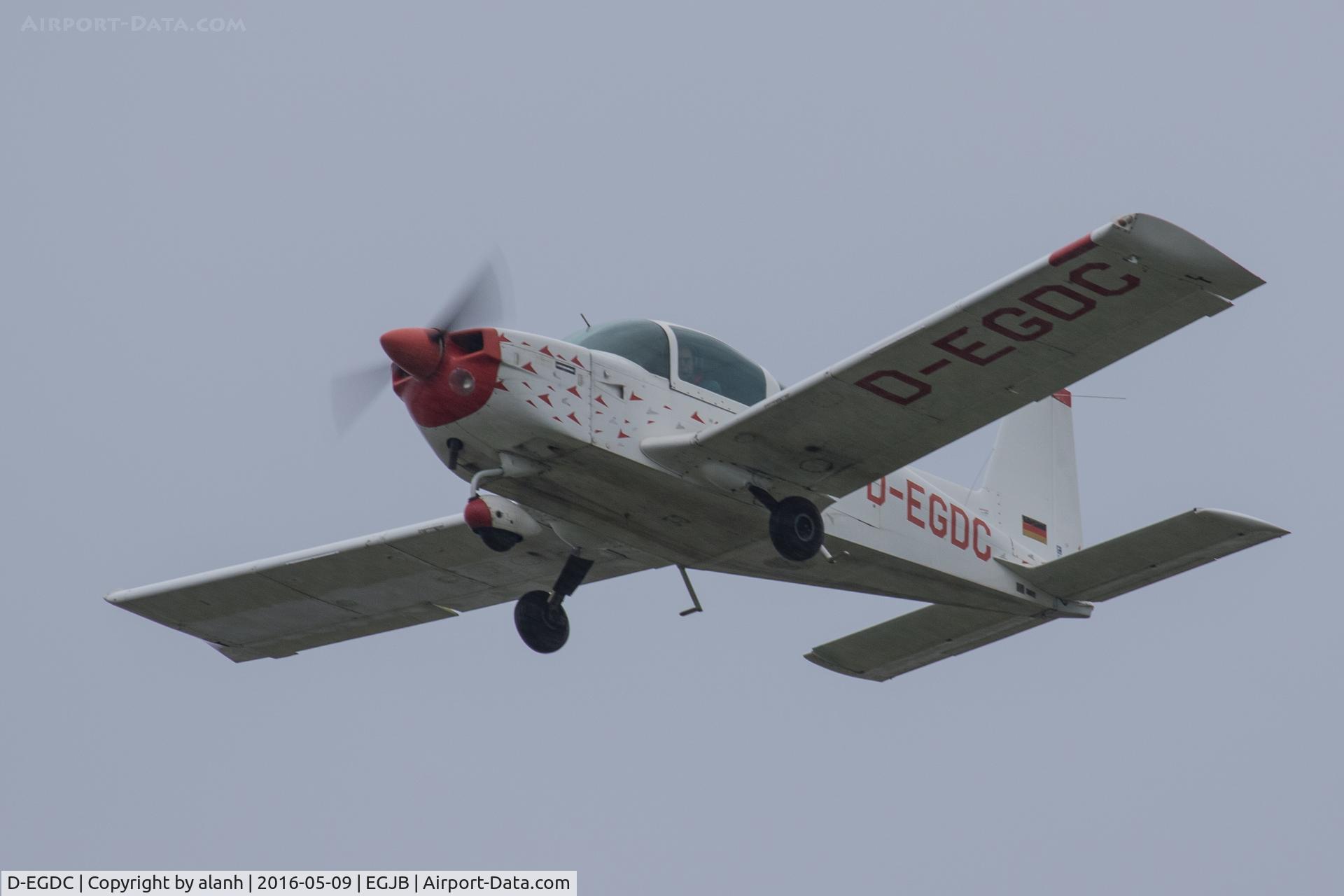 D-EGDC, 1978 Grumman American AA-5B Tiger C/N AA5B-0728, Departing Guernsey on a grey, wet day