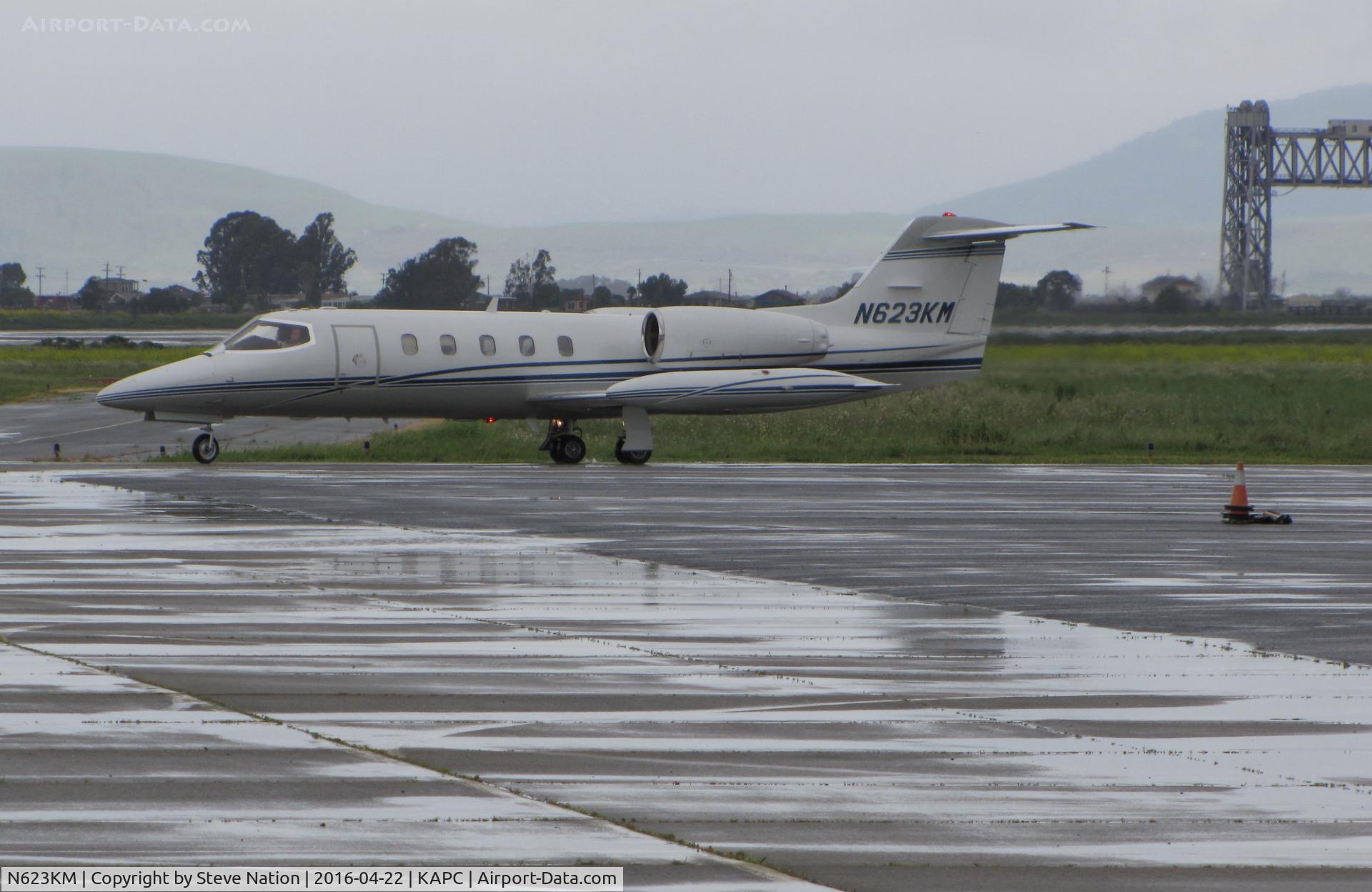 N623KM, 1980 Gates Learjet 35A C/N 307, Quarry Lane LLC (Chatsworth, CA) 1980 Gates Learjet 35A  arriving from KSJC @ a rainy Napa County Airport, CA (iconic Napa River Railroad Bridge in the background)