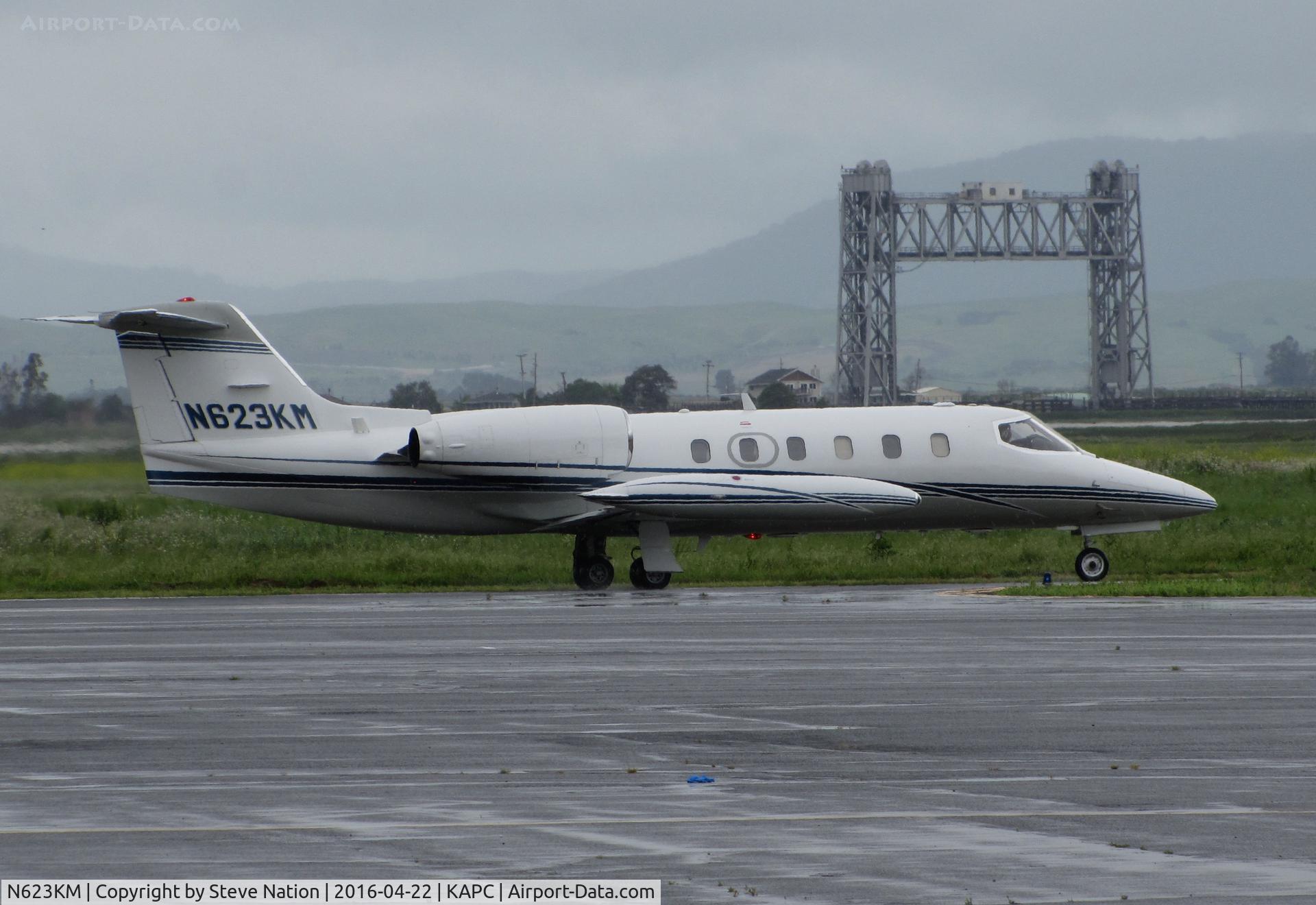 N623KM, 1980 Gates Learjet 35A C/N 307, Quarry Lane LLC (Chatsworth, CA) 1980 Gates Learjet 35A leaving rainy Napa County Airport, CA for flight to KSBA (iconic Napa River Railroad Bridge in background)