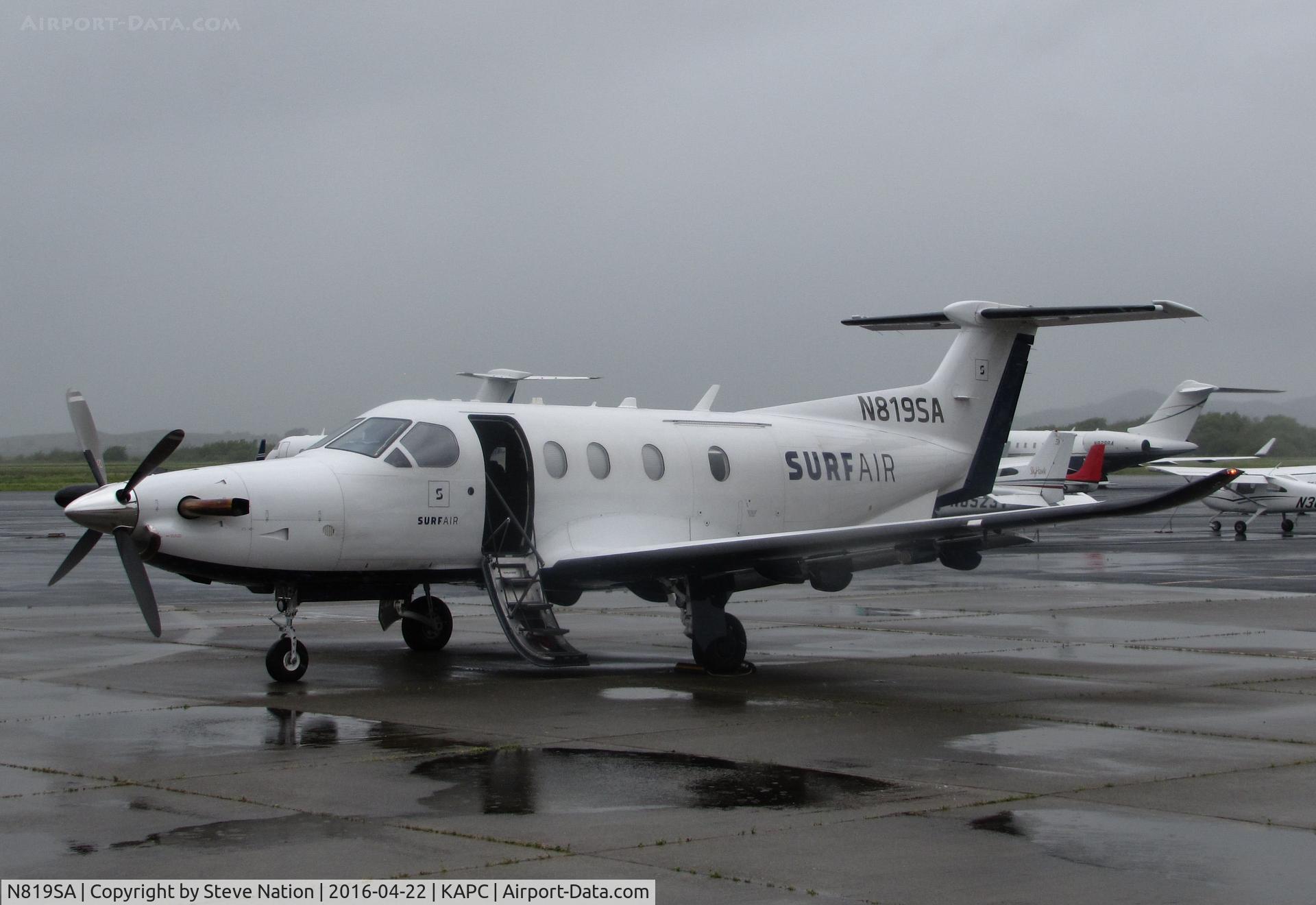 N819SA, 2014 Pilatus PC-12/47E C/N 1512, SURF AIR 2014 Pilatus PC-12/47E in from KHHR with airstair down @ rainy Napa County Airport, CA