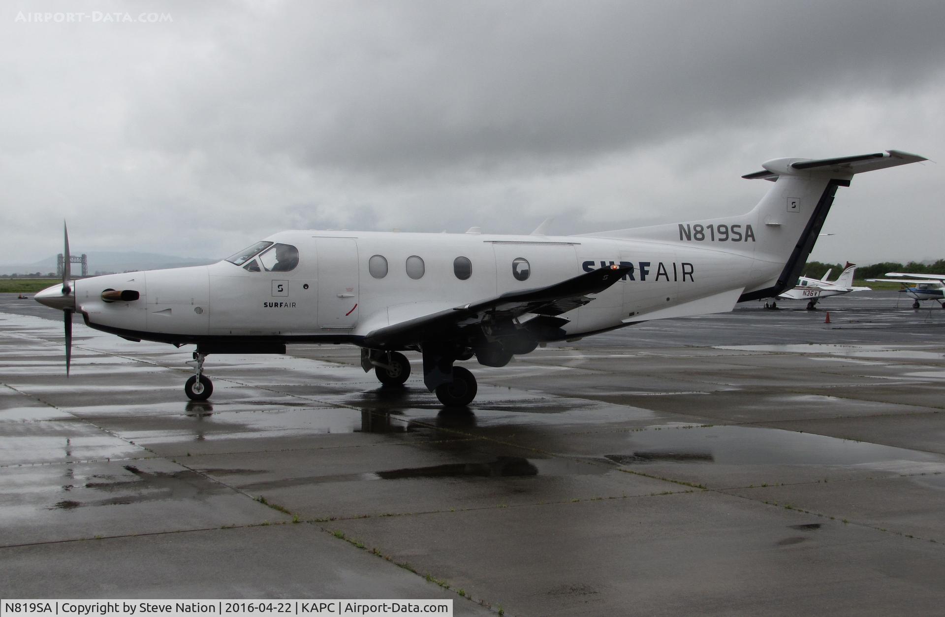 N819SA, 2014 Pilatus PC-12/47E C/N 1512, SURF AIR 2014 Pilatus PC-12/47E taxis out for return flight to KHHR from rainy Napa County Airport, CA