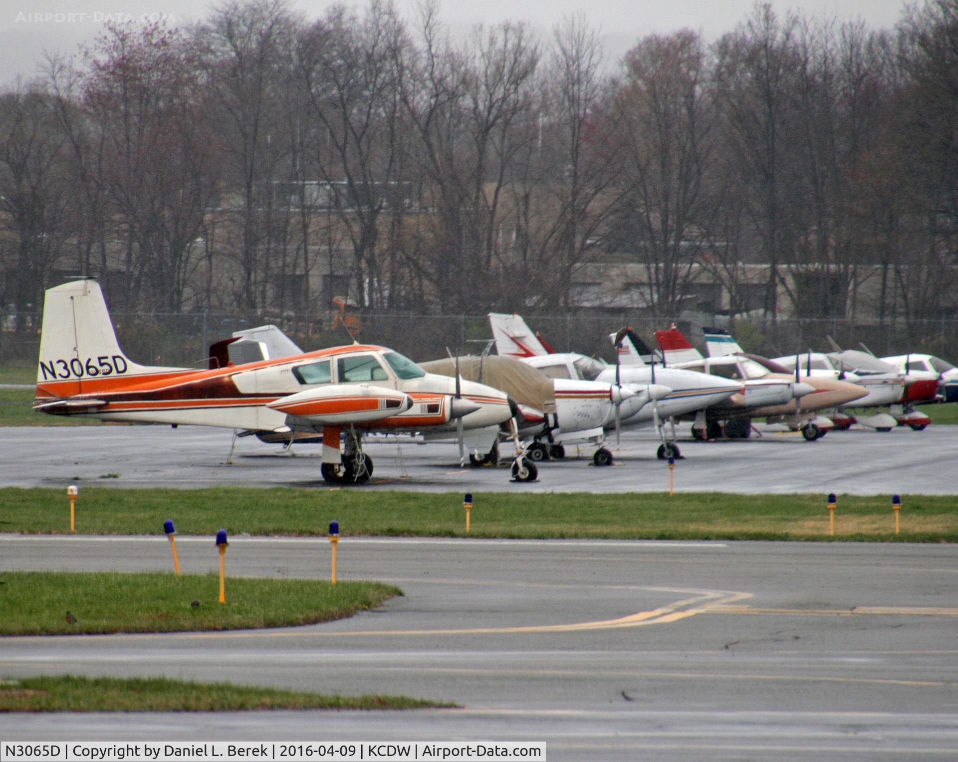N3065D, 1956 Cessna 310 C/N 35265, A classic 1956 Cessna 310 heads a line-up of younger stablemates at CDW.