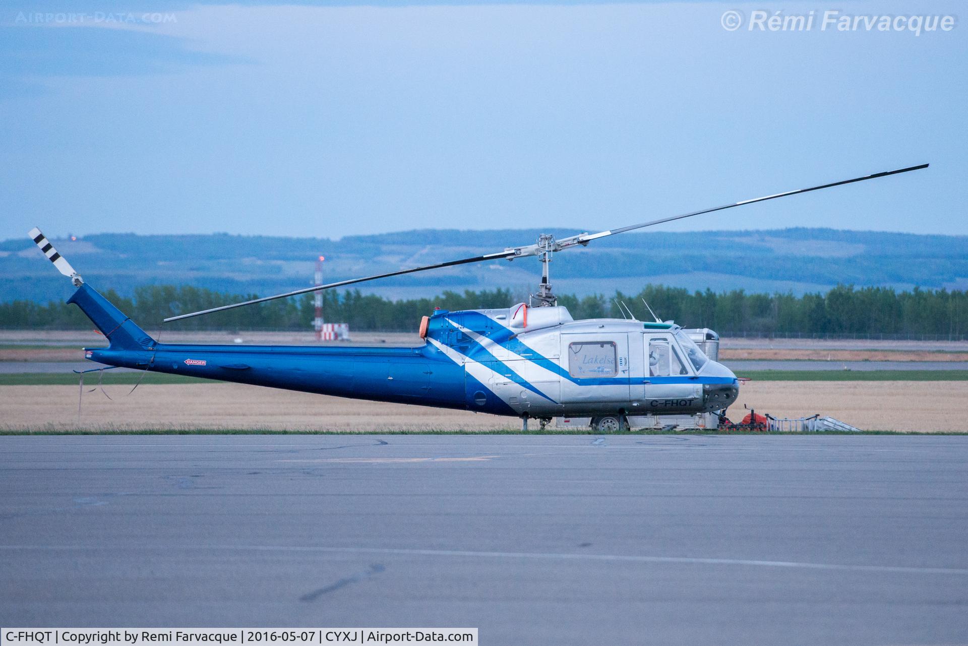 C-FHQT, 1967 Bell 204B C/N 2024, Fighting our forest fires. Parked on apron opposite control tower.