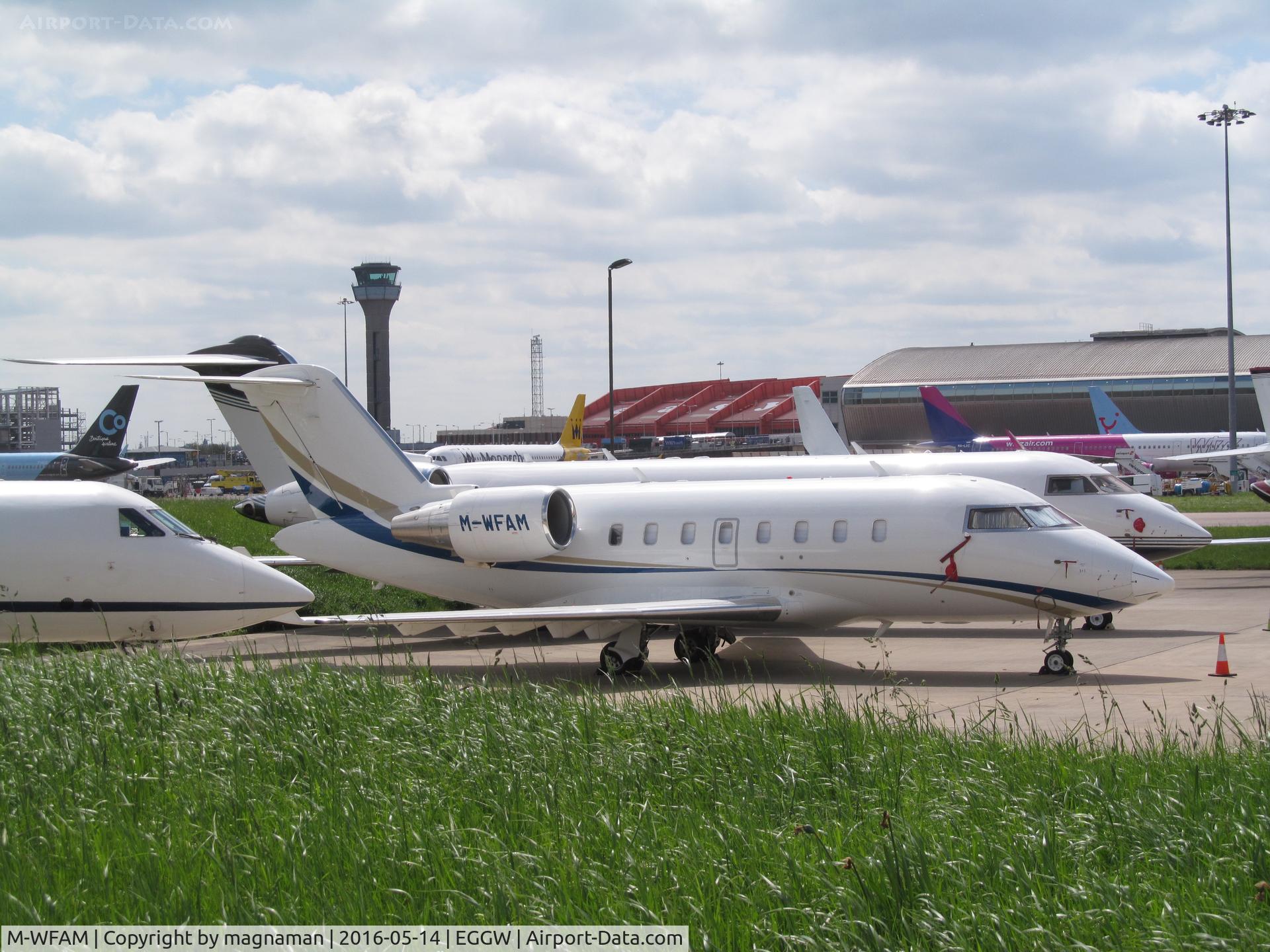 M-WFAM, 2012 Bombardier Challenger 605 (CL-600-2B16) C/N 5914, on apron at  luton