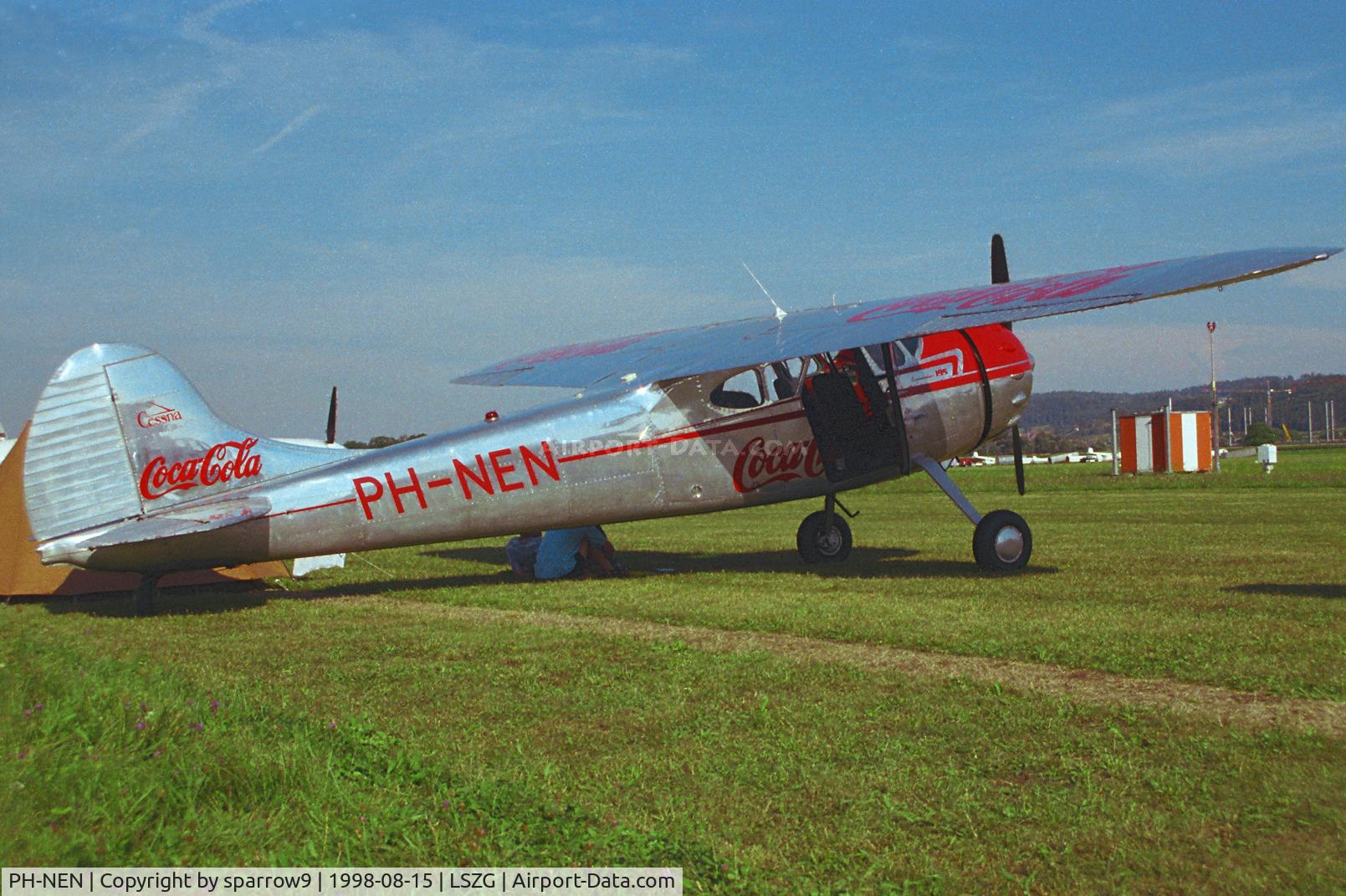 PH-NEN, 1950 Cessna 195 C/N 7496, Oldtimer meet Grenchen. Camping under the wing. Scanned from a slide