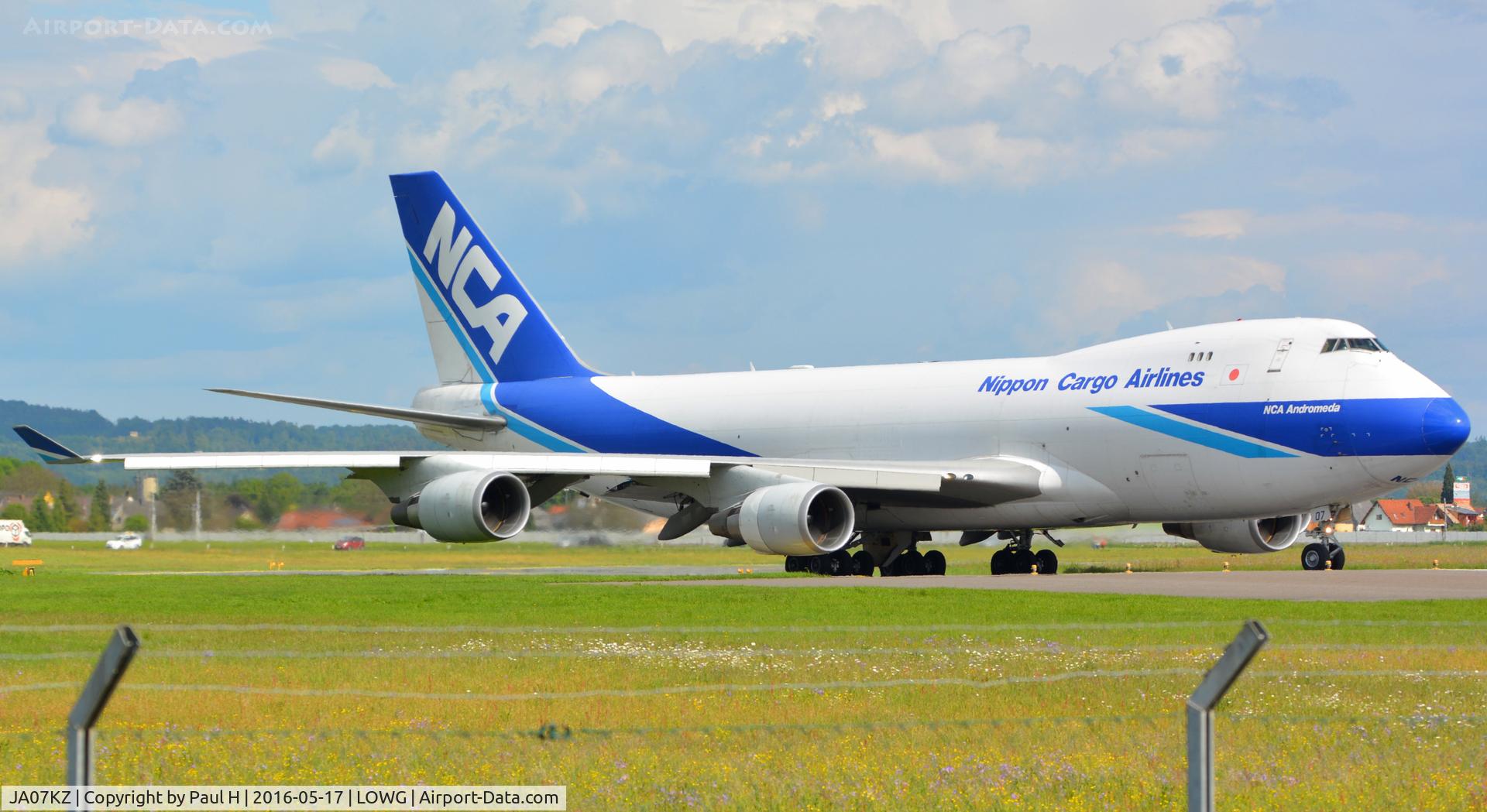 JA07KZ, 2008 Boeing 747-4KZF C/N 36134, Nippon Cargo NCA B747-400F turning for take-off from LOWG with the RedBull AirRace planes