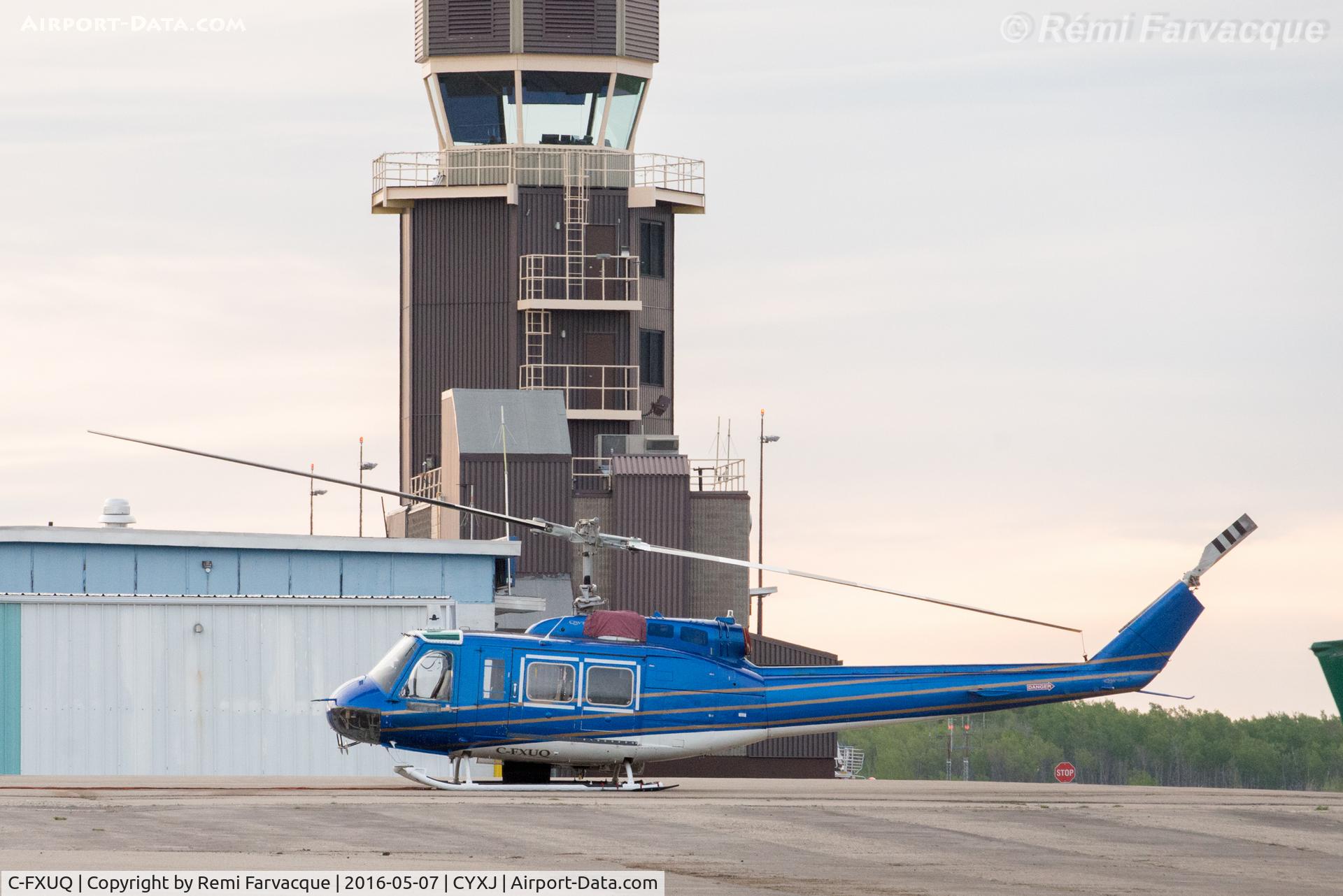 C-FXUQ, 1975 Bell 205A-1 C/N 30176, Parked by control tower. Fighting forest fires during the day.