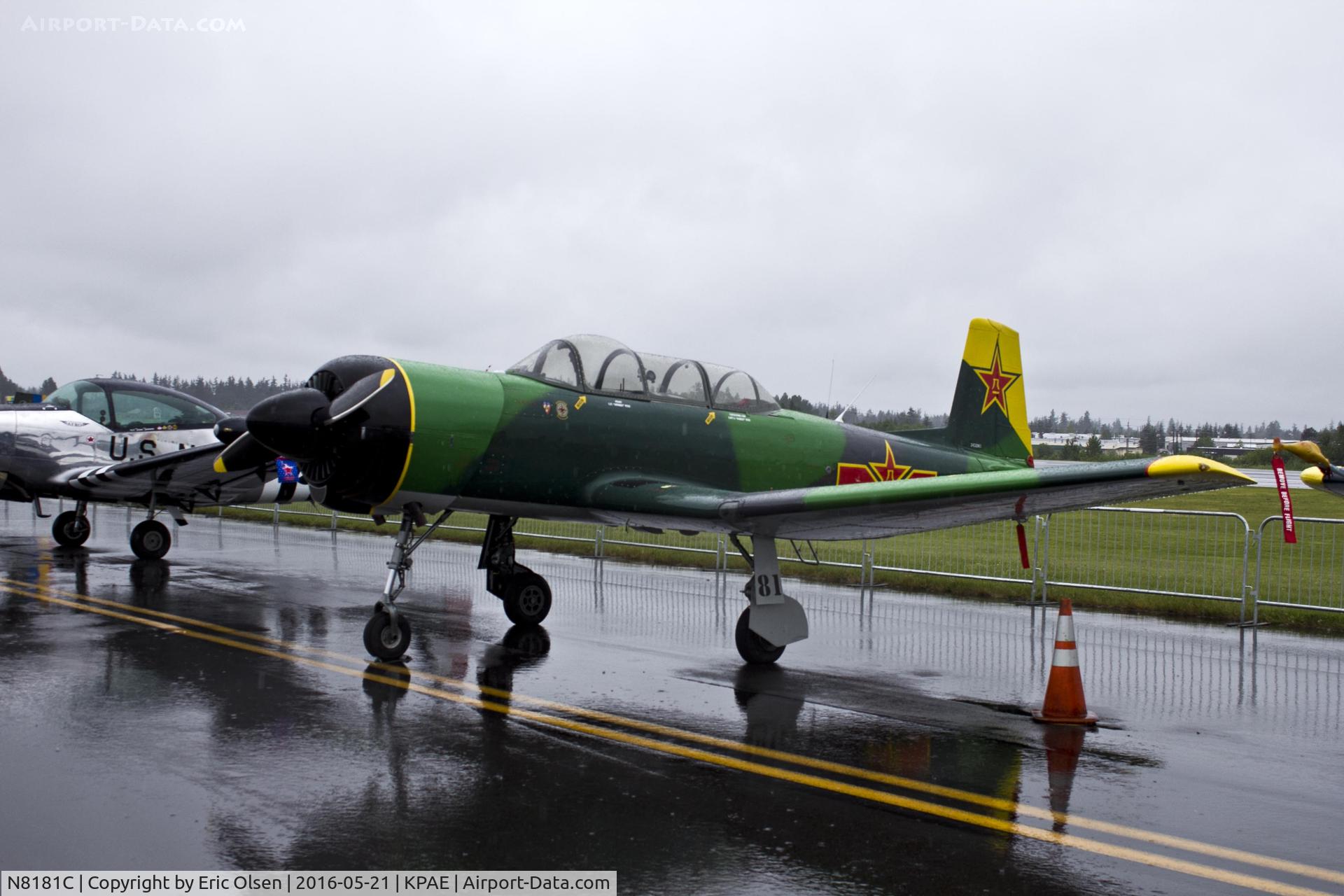 N8181C, 1973 Nanchang CJ-6A C/N 2432061, Nanchang CJ-6A waiting for the rain to stop at the 2016 Paine Field General Aviation Day. This a/c now calls Washington State home and is one of many CJ-6's that are owned by members of the Cascade Warbirds.