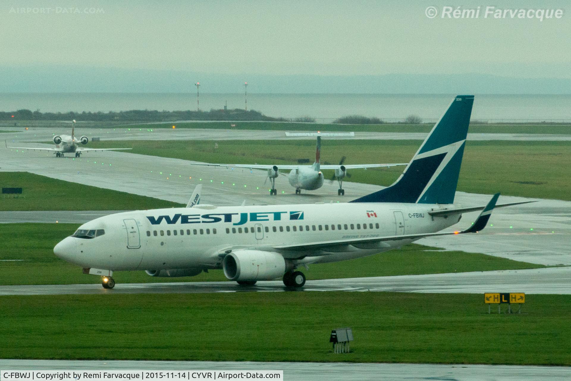 C-FBWJ, 2005 Boeing 737-7CT C/N 32767, Taxiing to domestic after north runway landing.