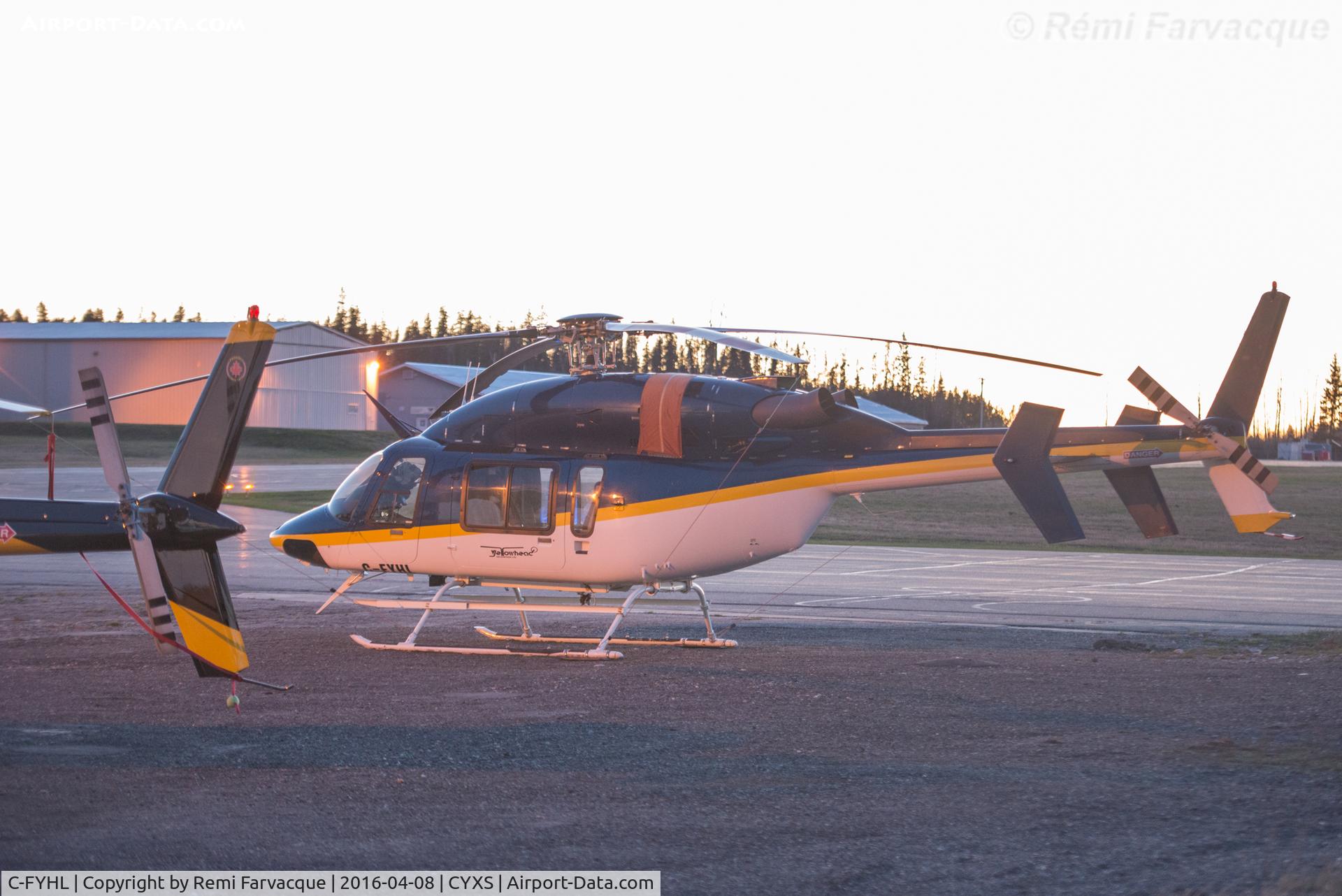 C-FYHL, 2000 Bell 427 C/N 56020, Parked south of main terminal. Horrible lighting.
