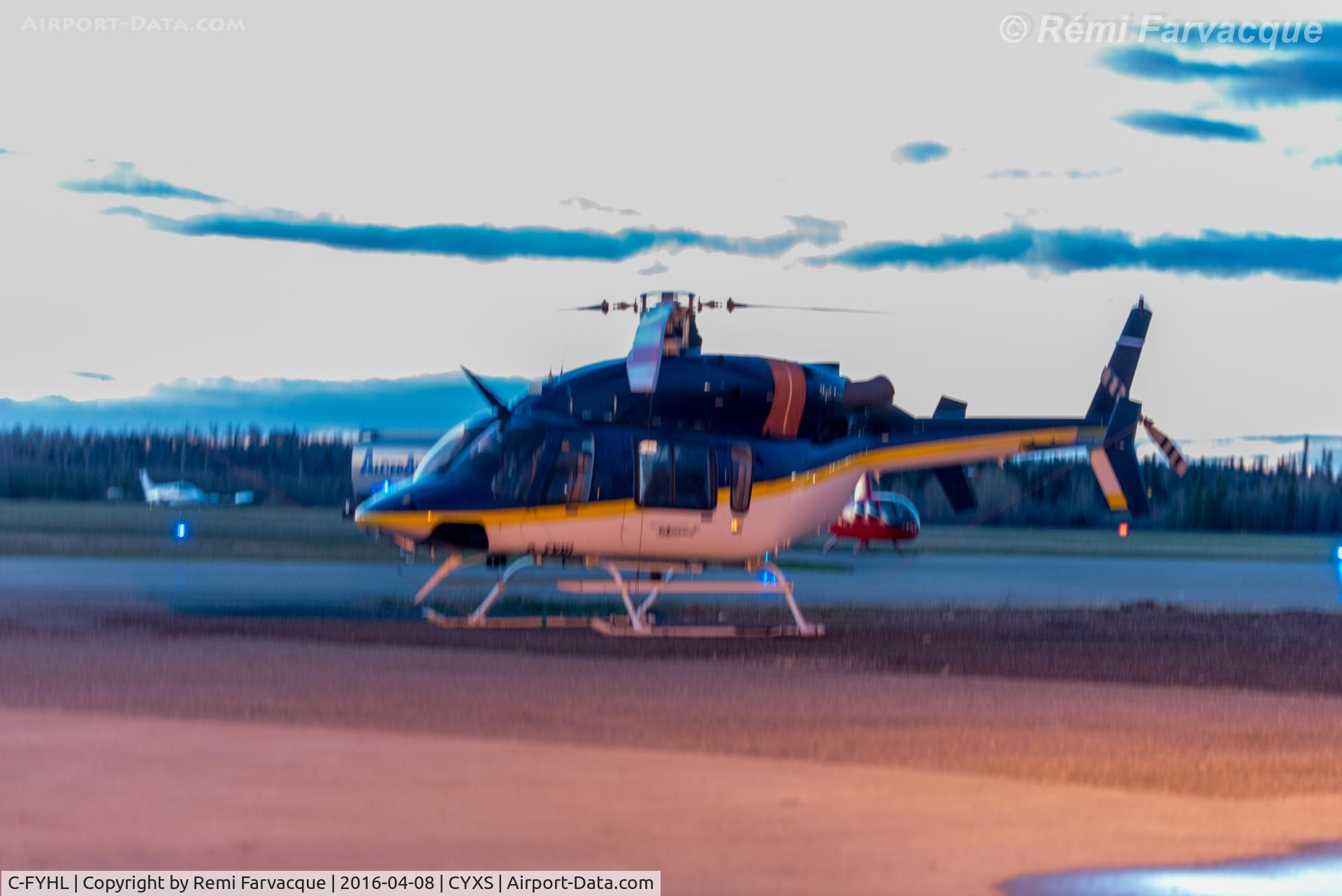C-FYHL, 2000 Bell 427 C/N 56020, Parked south of main terminal. Horrible lighting.