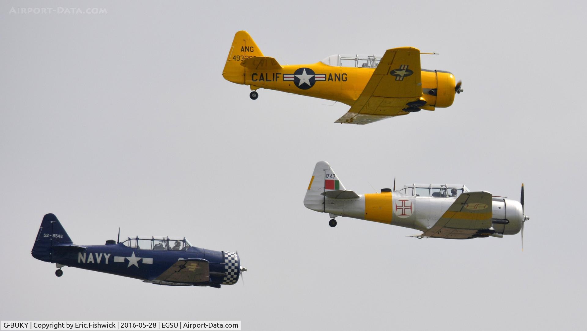 G-BUKY, 1952 Canadian Car & Foundry T-6H Harvard Mk.4M C/N CCF4-464, 45. Three Harvards in close formation at the IWM American Airshow, May 2016.