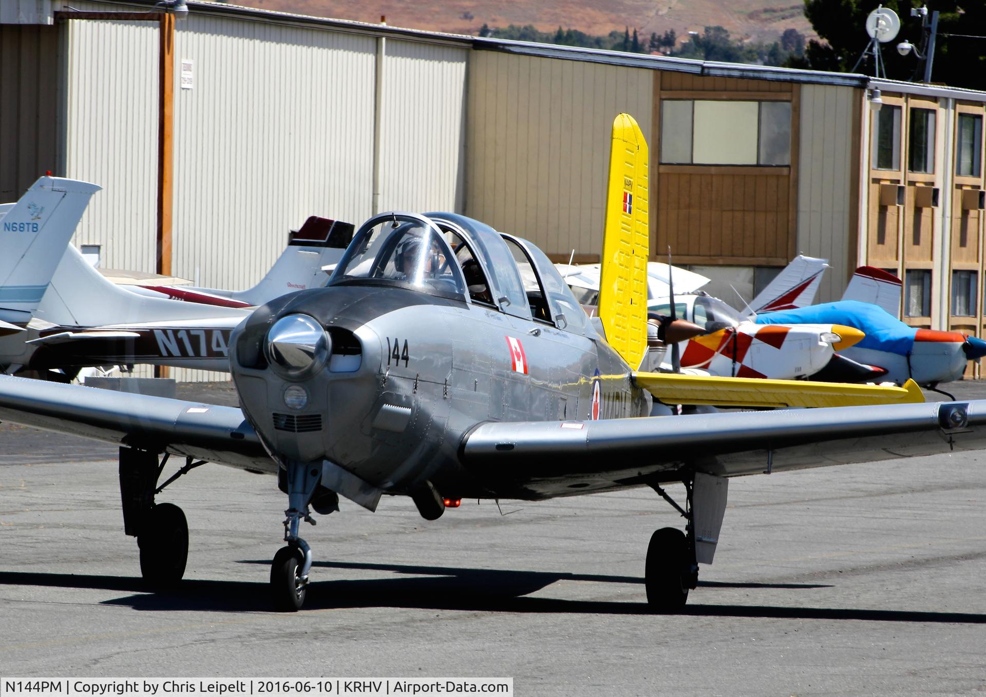 N144PM, 1957 Beechcraft T34B Mentor C/N BG-404, Livermore-based 1957 Beechcraft T34B Mentor taxing out for departure at Reid Hillview Airport, San Jose, CA.