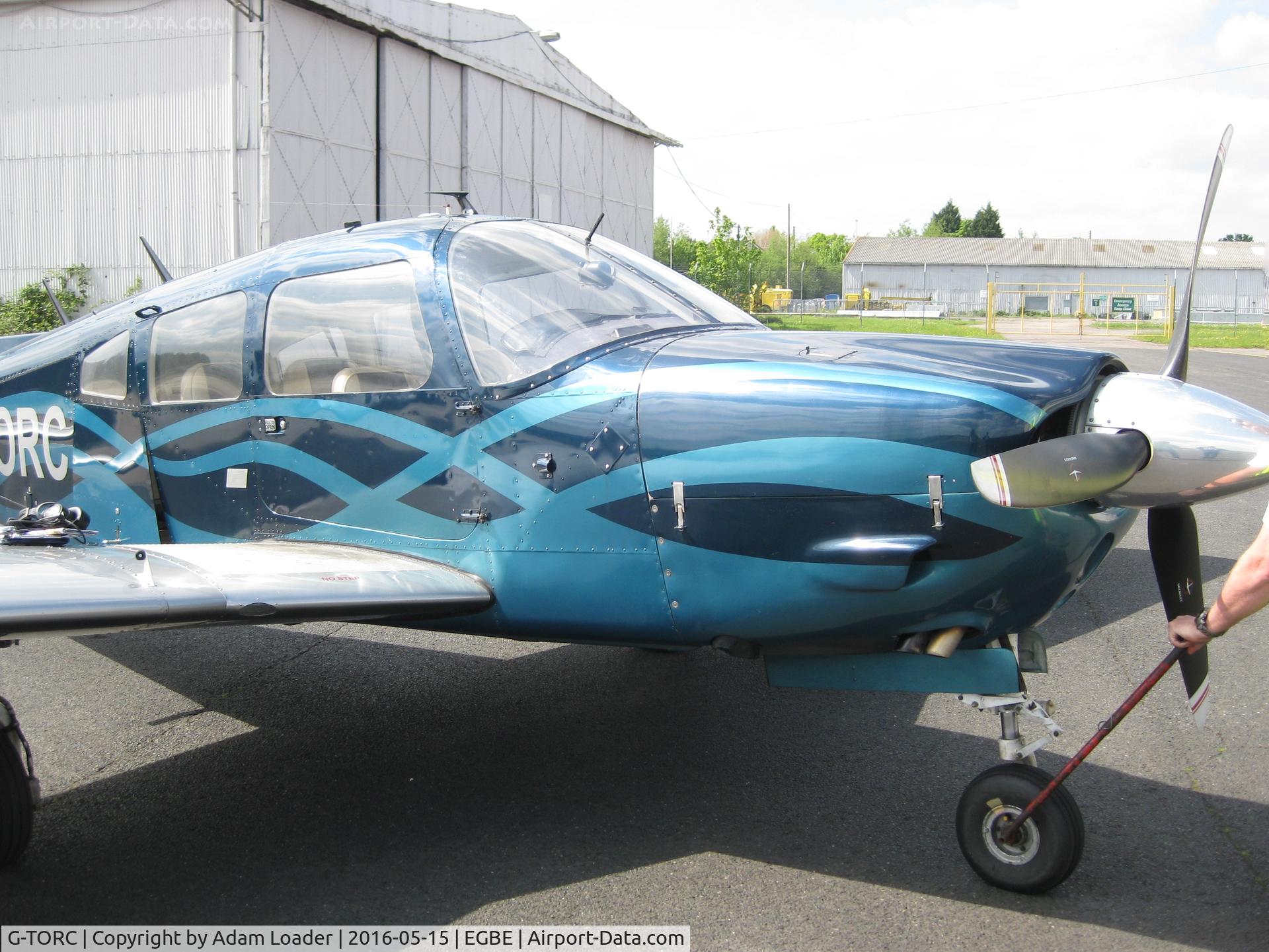 G-TORC, 1974 Piper PA-28R-200 Cherokee Arrow C/N 28R-7535036, G-TORC being pushed into her tiedown position at Coventry Airport