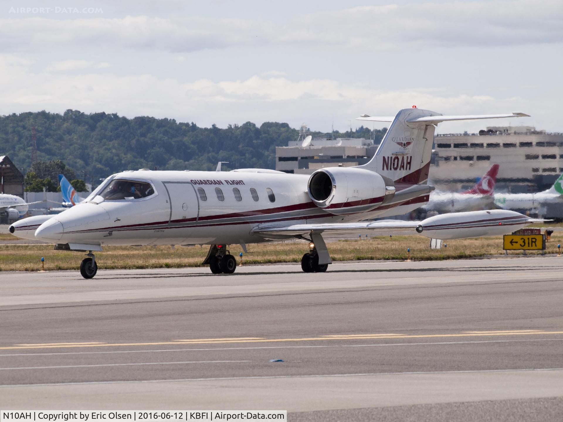 N10AH, 1990 Gates Learjet 35A C/N 657, Learjet taxing by for takeoff.