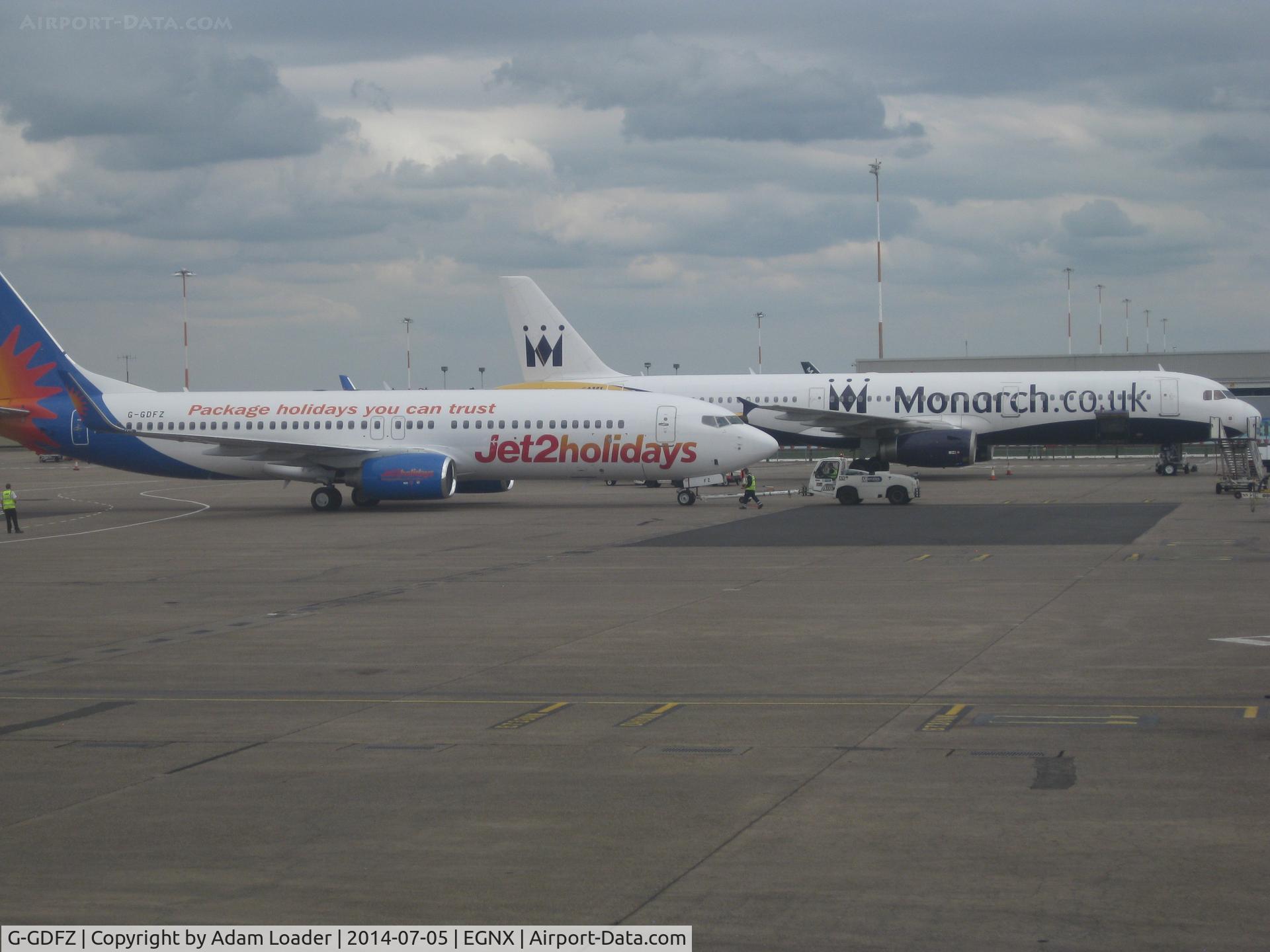 G-GDFZ, 2001 Boeing 737-86Q C/N 30276, G-GDFZ sharing the apron at East Midlands with a Monarch A321