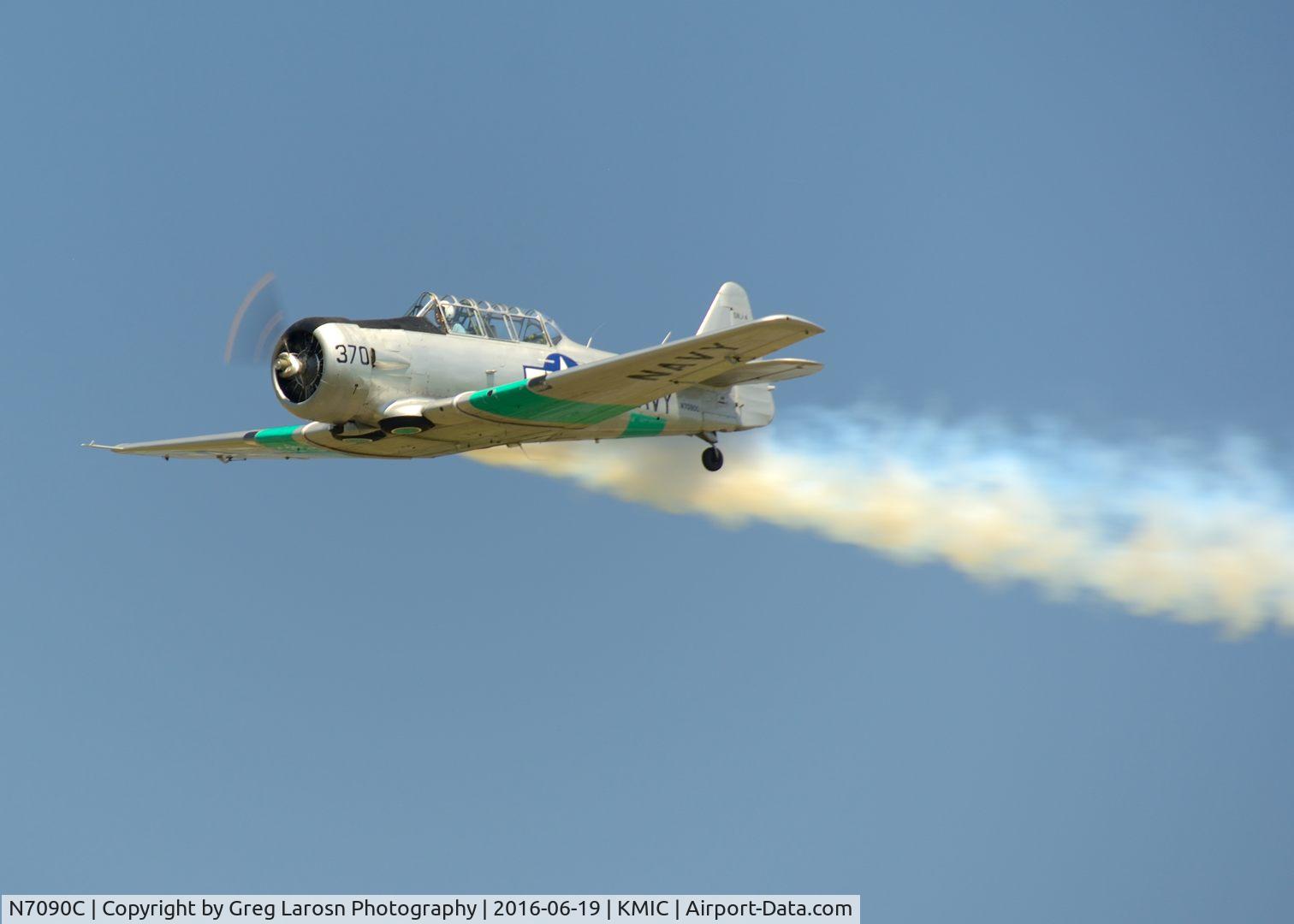 N7090C, North American SNJ-4 Texan C/N 88-13370, Smokey flyover at airport open house at Crystal, MN.
