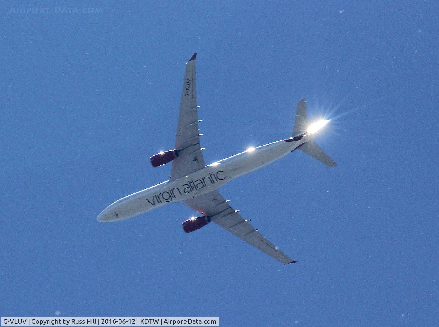 G-VLUV, 2010 Airbus A330-343X C/N 1206, On approach to DTW, approx. 15 miles out.

(White spots are cottonwood seeds floating in the air)