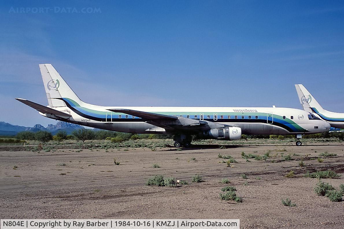 N804E, 1959 Douglas DC-8-51 C/N 45411, Douglas DC-8-51 [45411] (Mackey International Airlines) Marana-Pinal Airpark~N 16/10/1984. From a slide.