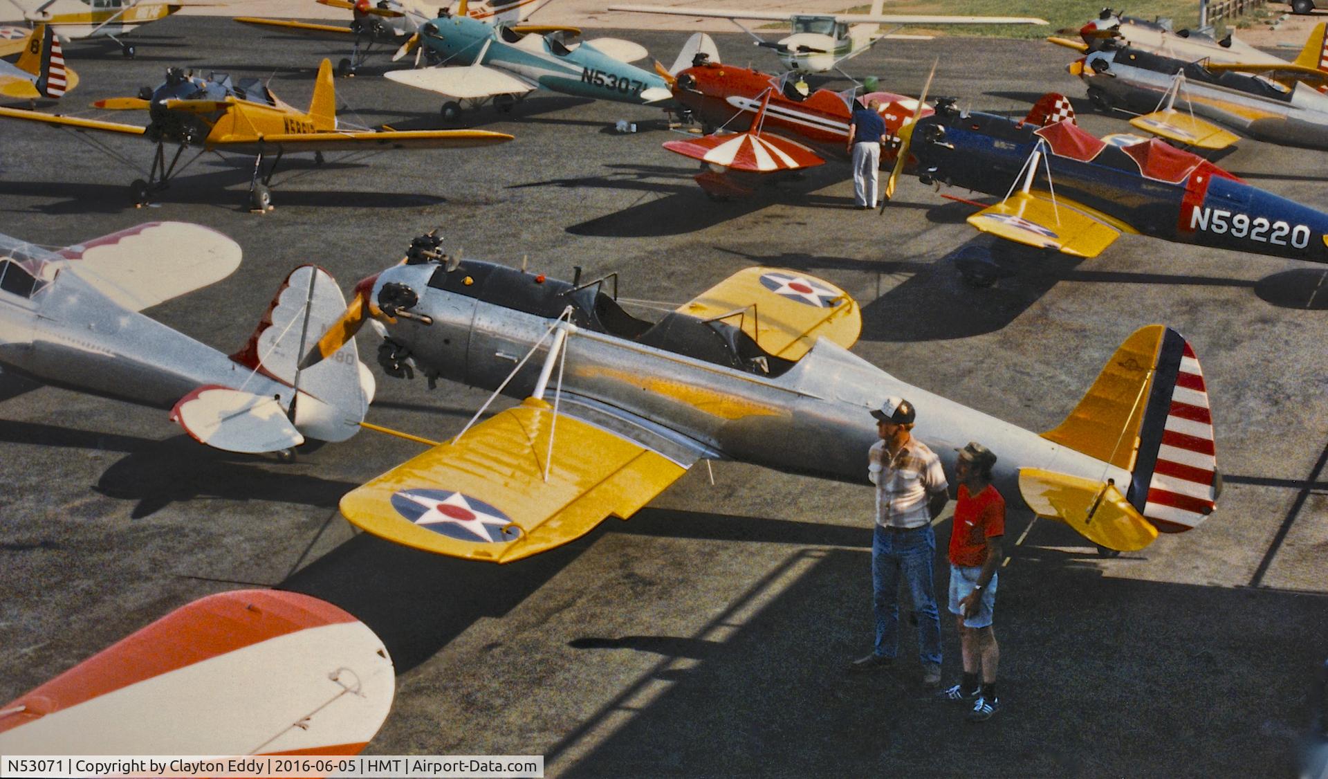 N53071, 1942 Ryan Aeronautical ST3KR C/N 1909, Green Plane in the background. Ryan flying at Hemet Ryan Airport in California.