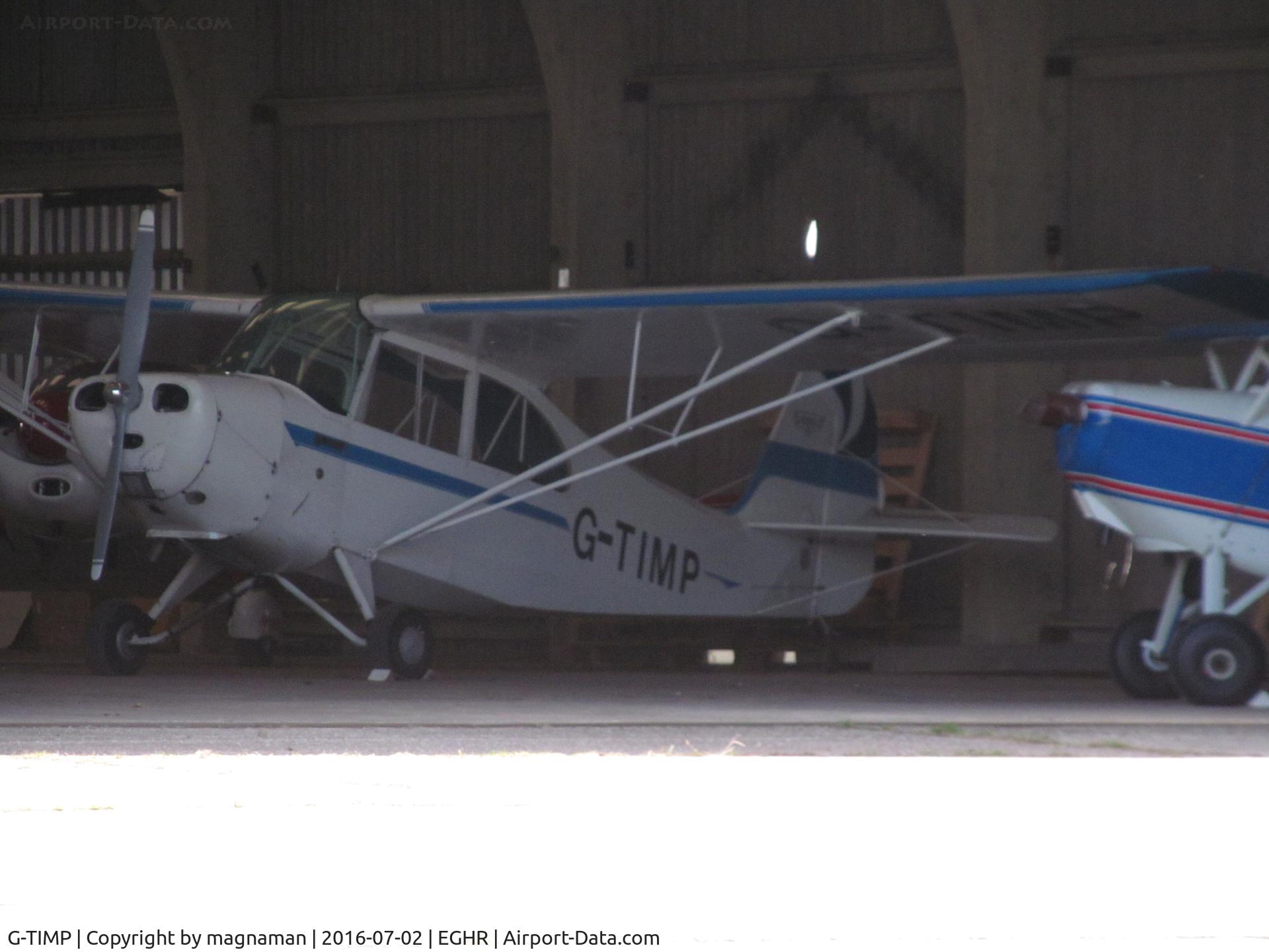 G-TIMP, 1946 Aeronca 7BCM C/N 7AC-3392, in gloomy hangar