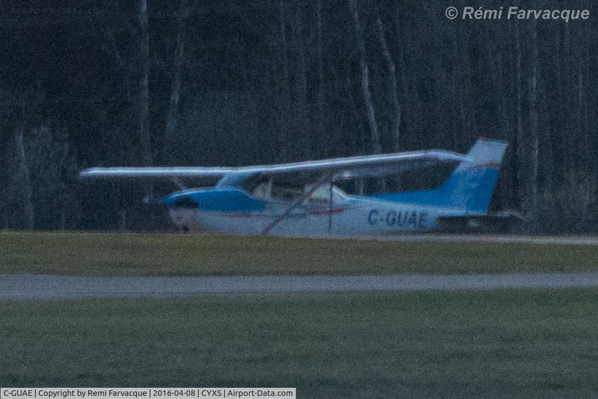 C-GUAE, 1973 Cessna 172M C/N 17262125, South area of airport. Pixelated due to distance.