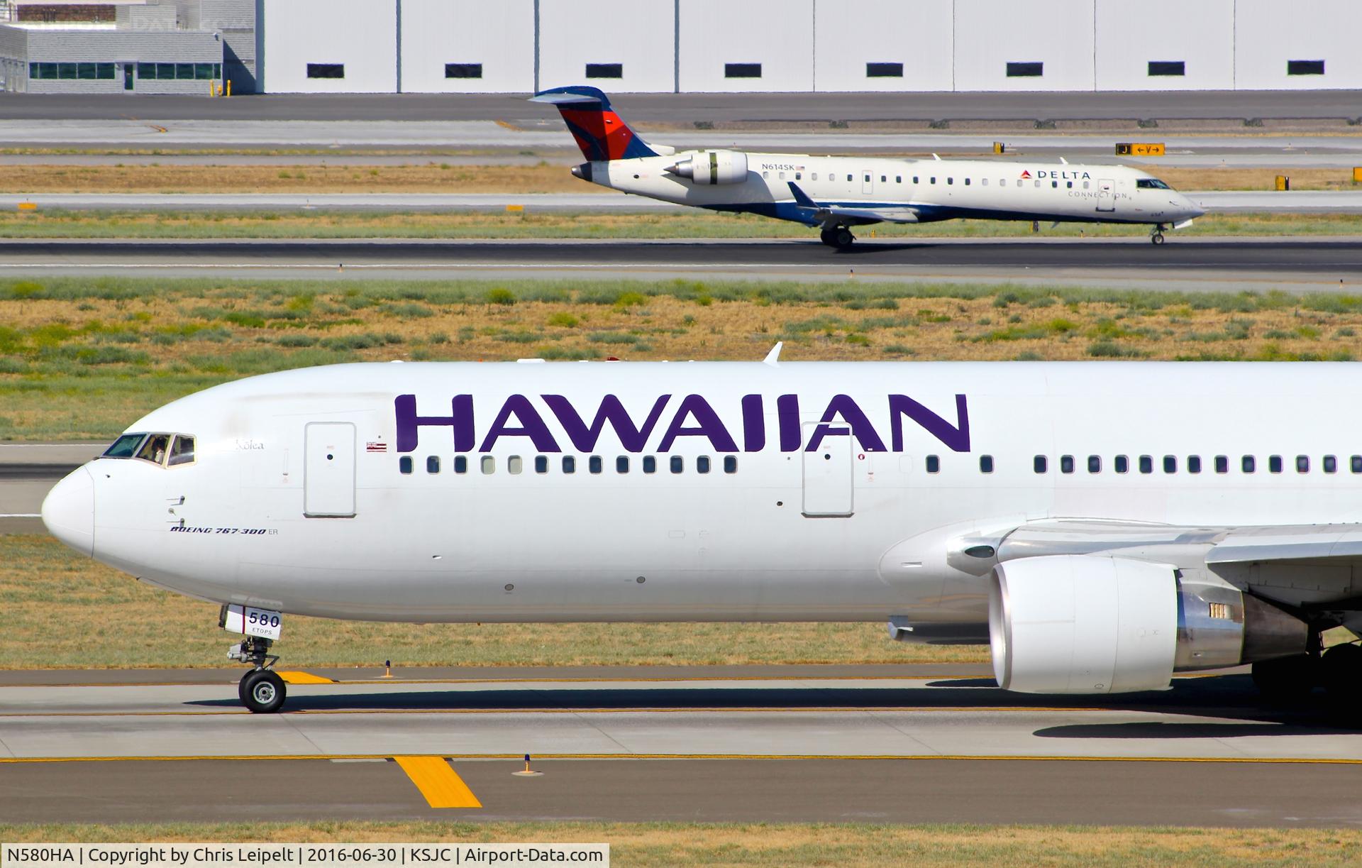 N580HA, 2001 Boeing 767-33A C/N 28140, Hawaiian Airlines taxing on Y for a departure to Hawaii at San Jose International Airport, CA.