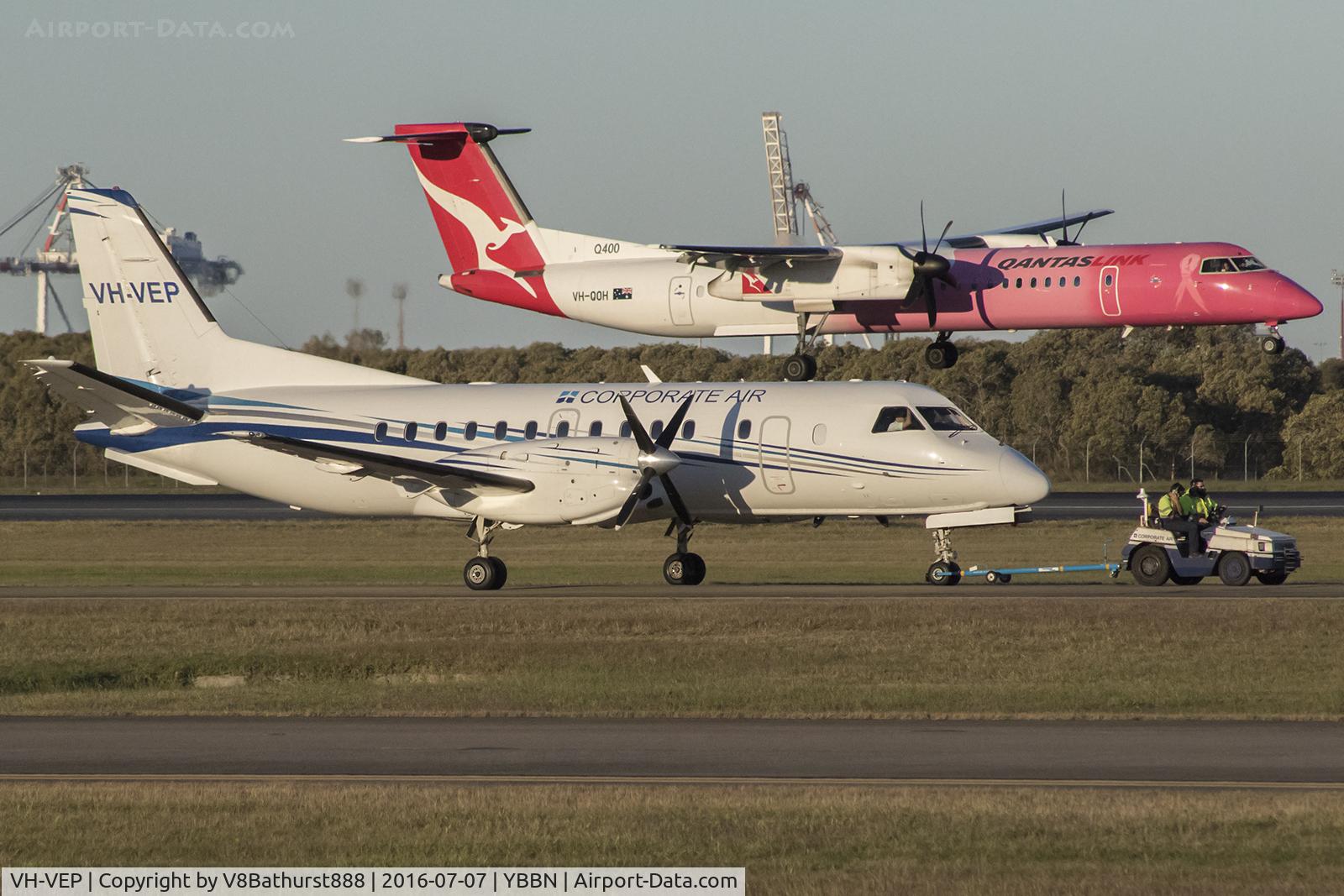 VH-VEP, 1995 Saab 340B C/N 340B-377, VEP under the tow while QOH starts the flare onto one niner