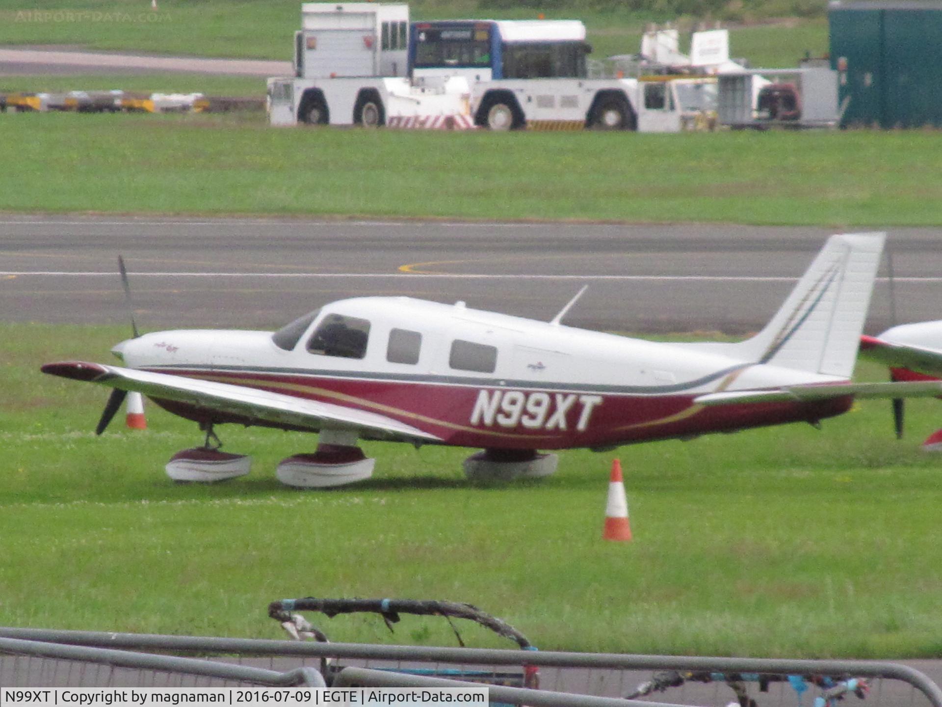 N99XT, 2004 Piper PA-32-301XTC Saratoga C/N 3255024, dull Exeter morning for long shot across apron