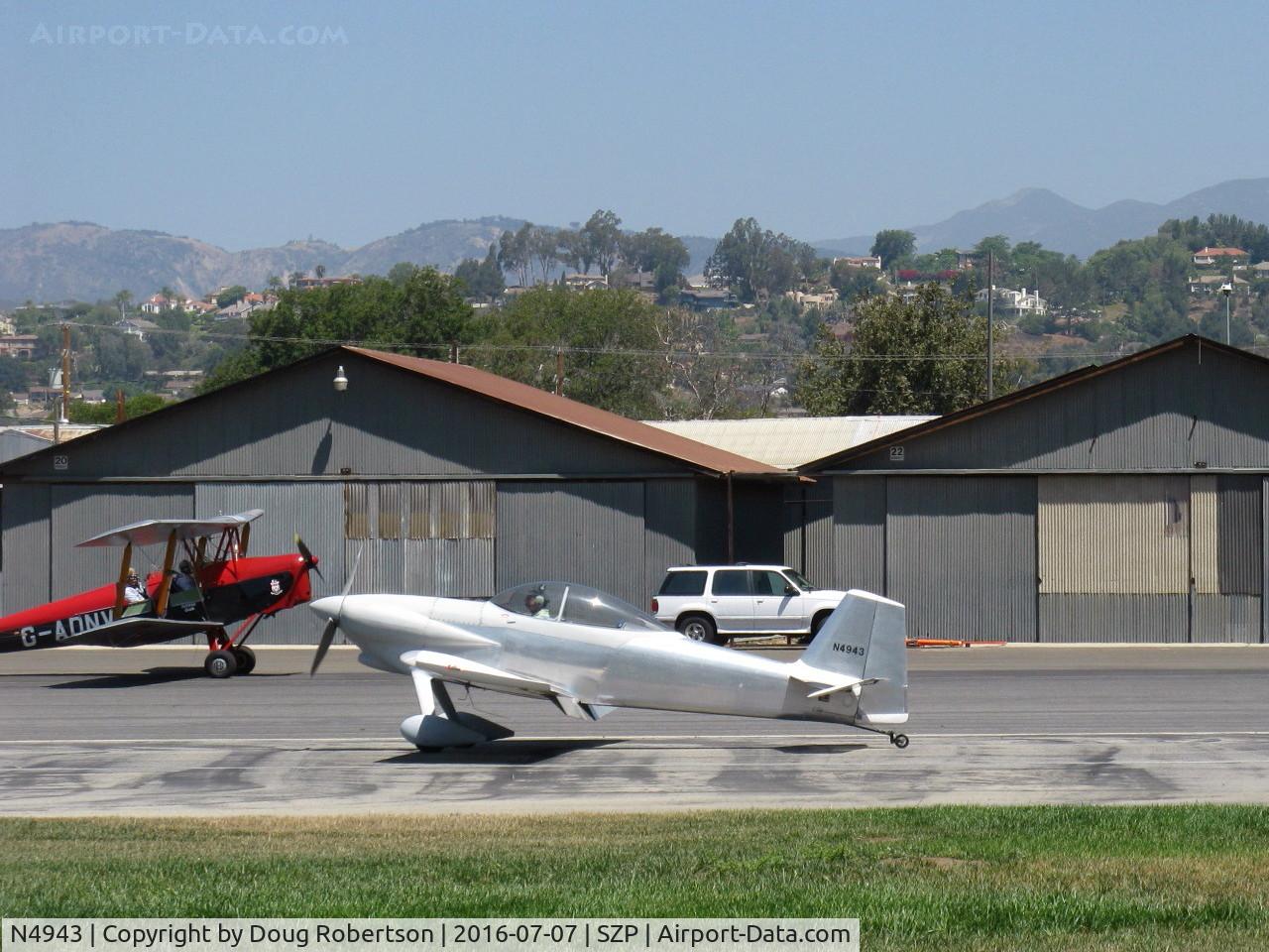 N4943, 2014 Vans RV-4 C/N 4311, 2014 Corson VAN's RV-4, Lycoming O-320-D2B 160 Hp, landing roll Rwy 22. That's N675LF 1944 DeHavilland DH-82A TIGER MOTH taxying on left, which see...