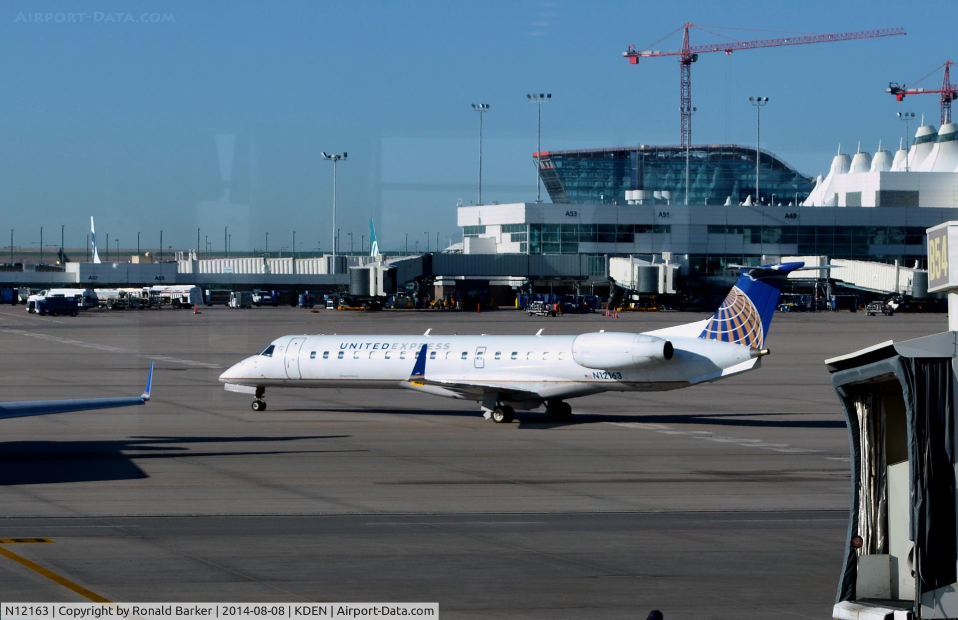 N12163, 2004 Embraer ERJ-145XR (EMB-145XR) C/N 14500811, Taxi Denver