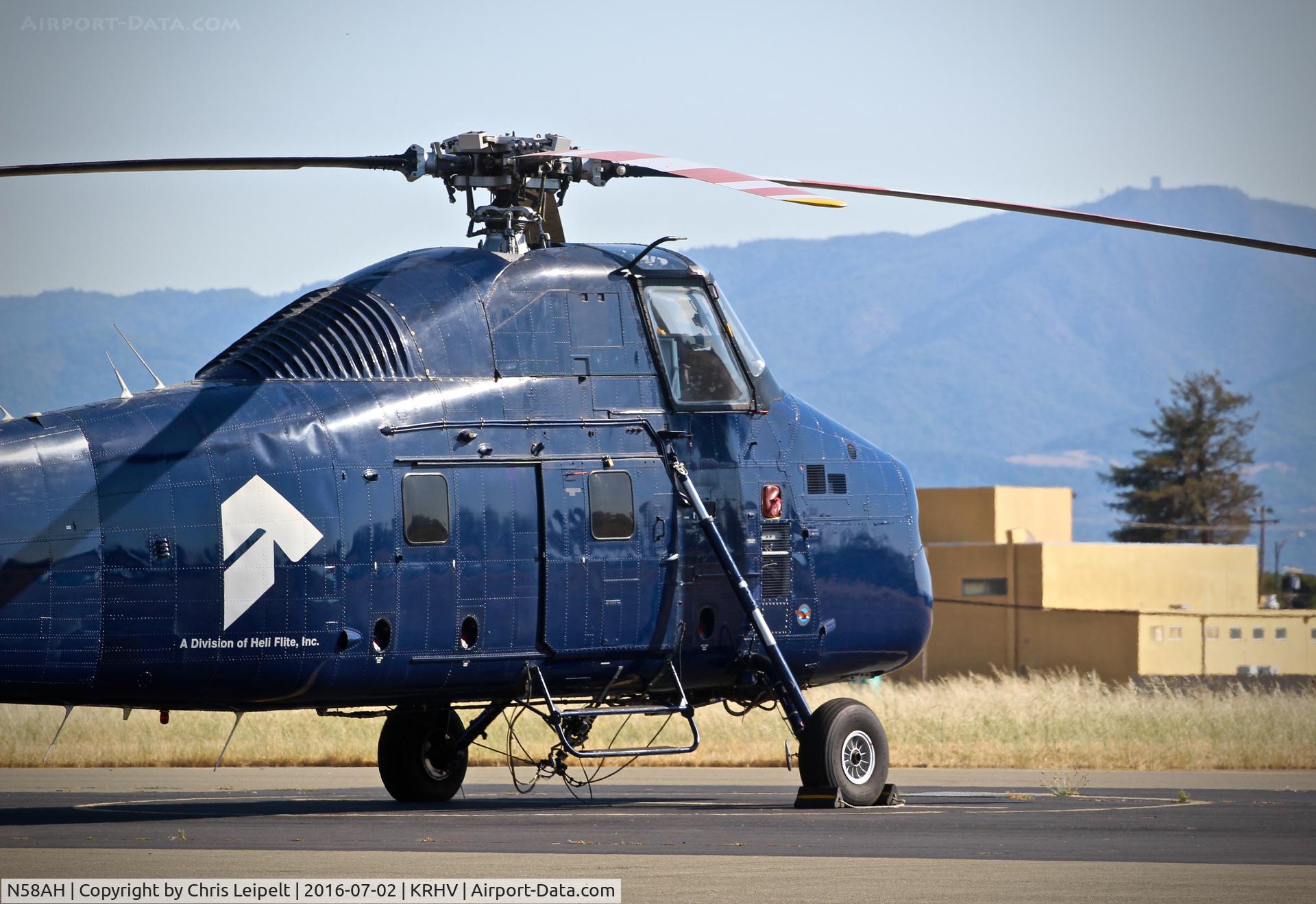 N58AH, 1956 Sikorsky S-58ET C/N 58-328, B&B Helos LLC (Perris, CA) 1956 Sikorsky S-56ET parked on the ramp with the infamous Mt. Umunhum in the background at Reid Hillview Airport, San Jose, CA.