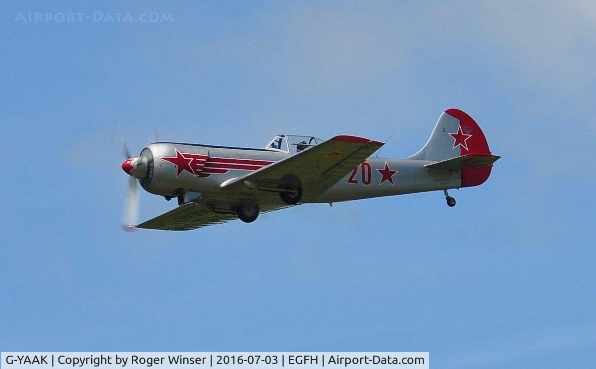 G-YAAK, 1981 Yakovlev Yak-50 C/N 812003, Red 20 of the Yakovlevs formation display team low pass over Runway 22.