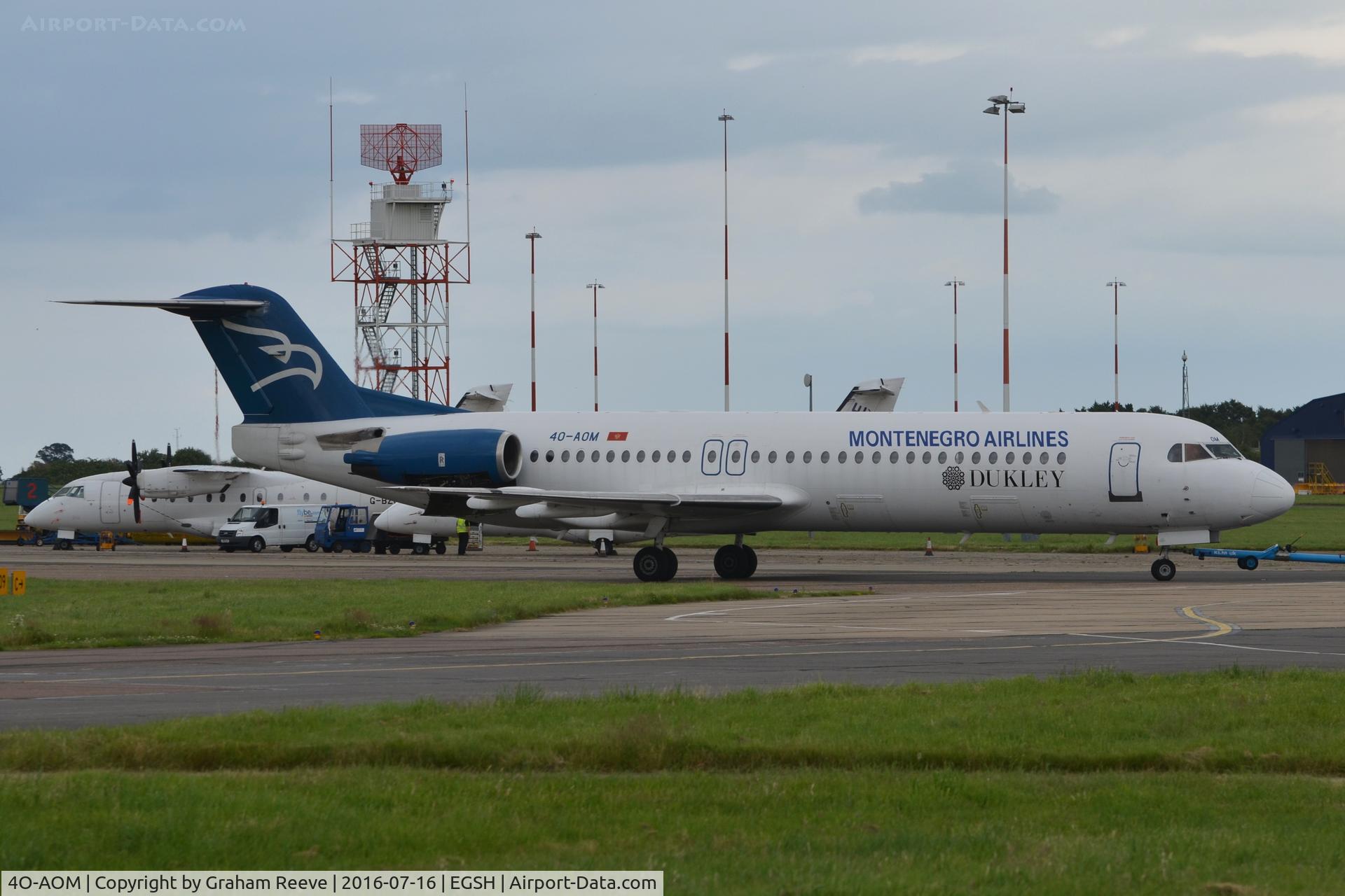 4O-AOM, 1990 Fokker 100 (F-28-0100) C/N 11321, Under tow at Norwich.
