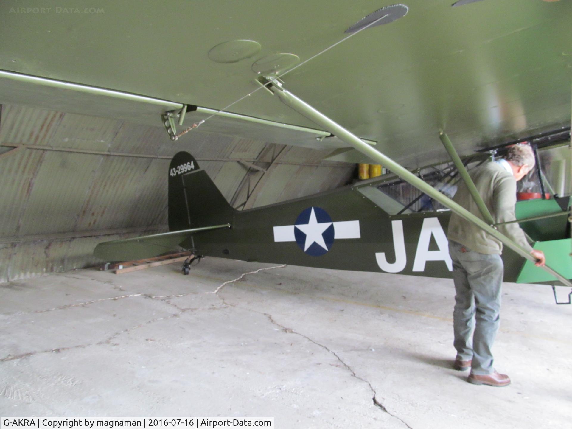 G-AKRA, 1944 Piper L-4H Grasshopper (J3C-65D) C/N 11255, at home hangar north of Cambridge - lovely work