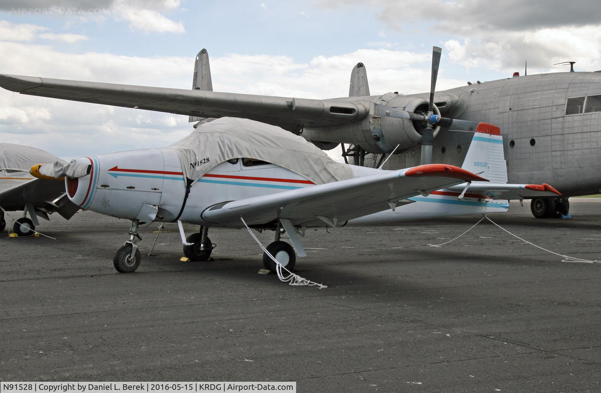 N91528, 1946 North American Navion C/N NAV-4-124, This classic (1946) early-build Navion is now part of the Mid Atlantic Air Museum; behind her is a Fairchild C-119 Flying Boxcar.