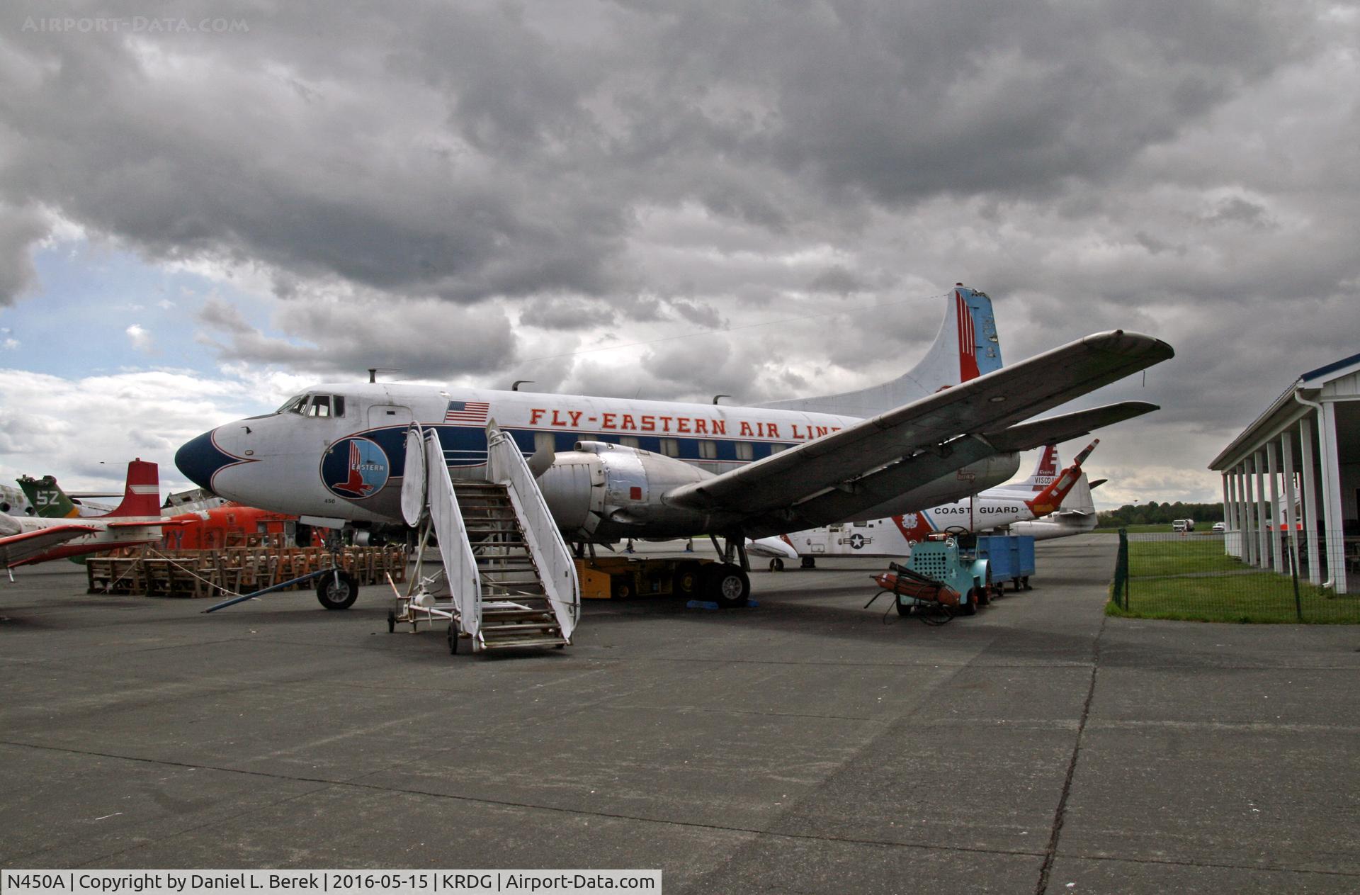 N450A, 1952 Martin 404 C/N 14141, A classic 1952 Martinliner looks out against a dramatic weather backdrop.