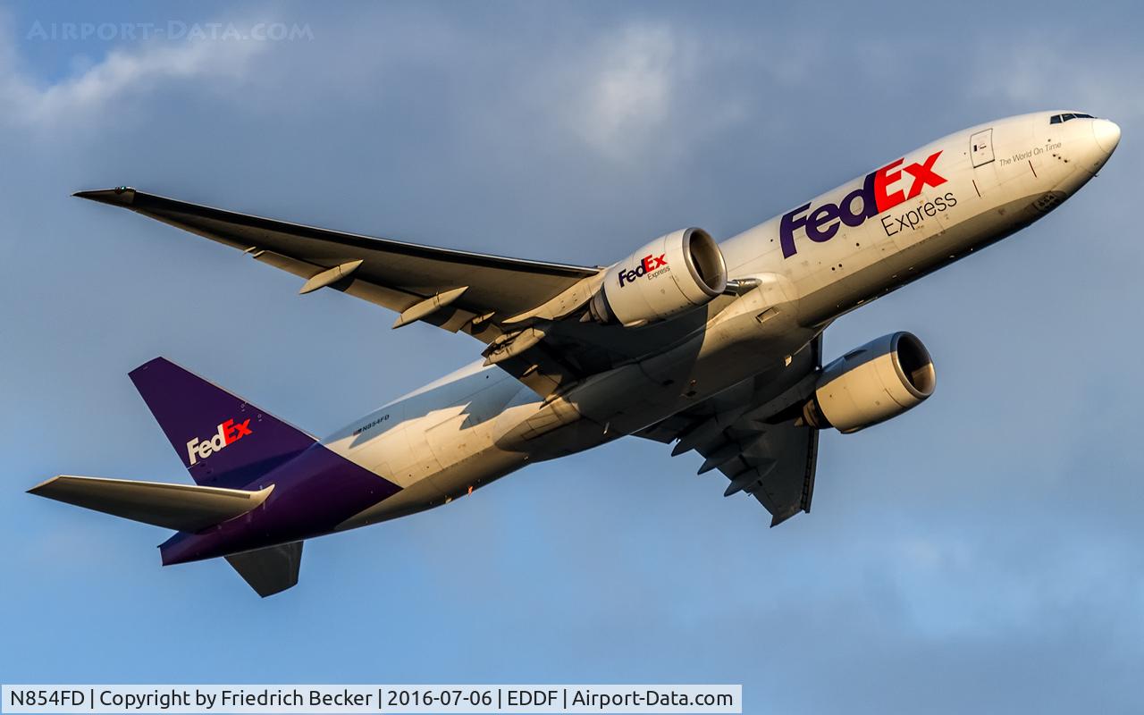 N854FD, 2010 Boeing 777-FS2 C/N 37725, departure via RW25C