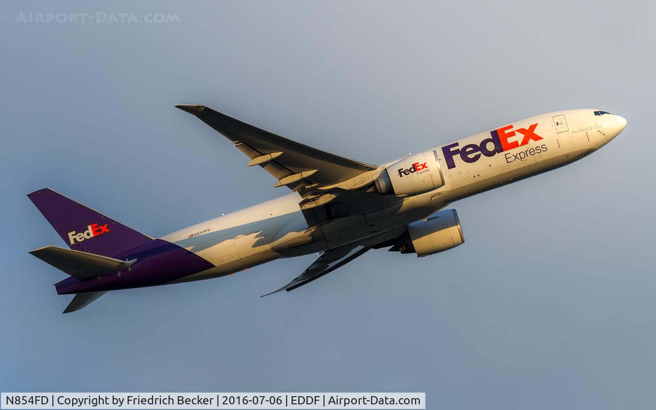 N854FD, 2010 Boeing 777-FS2 C/N 37725, departure via RW25C