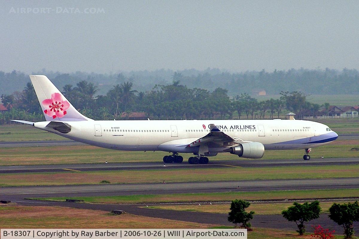 B-18307, 2005 Airbus A330-302 C/N 691, Airbus A330-302 [691] (China Airlines) Jakarta-Soekarno Hatta Int'l~PK 26/10/2006. Taken through glass window of hotel.
