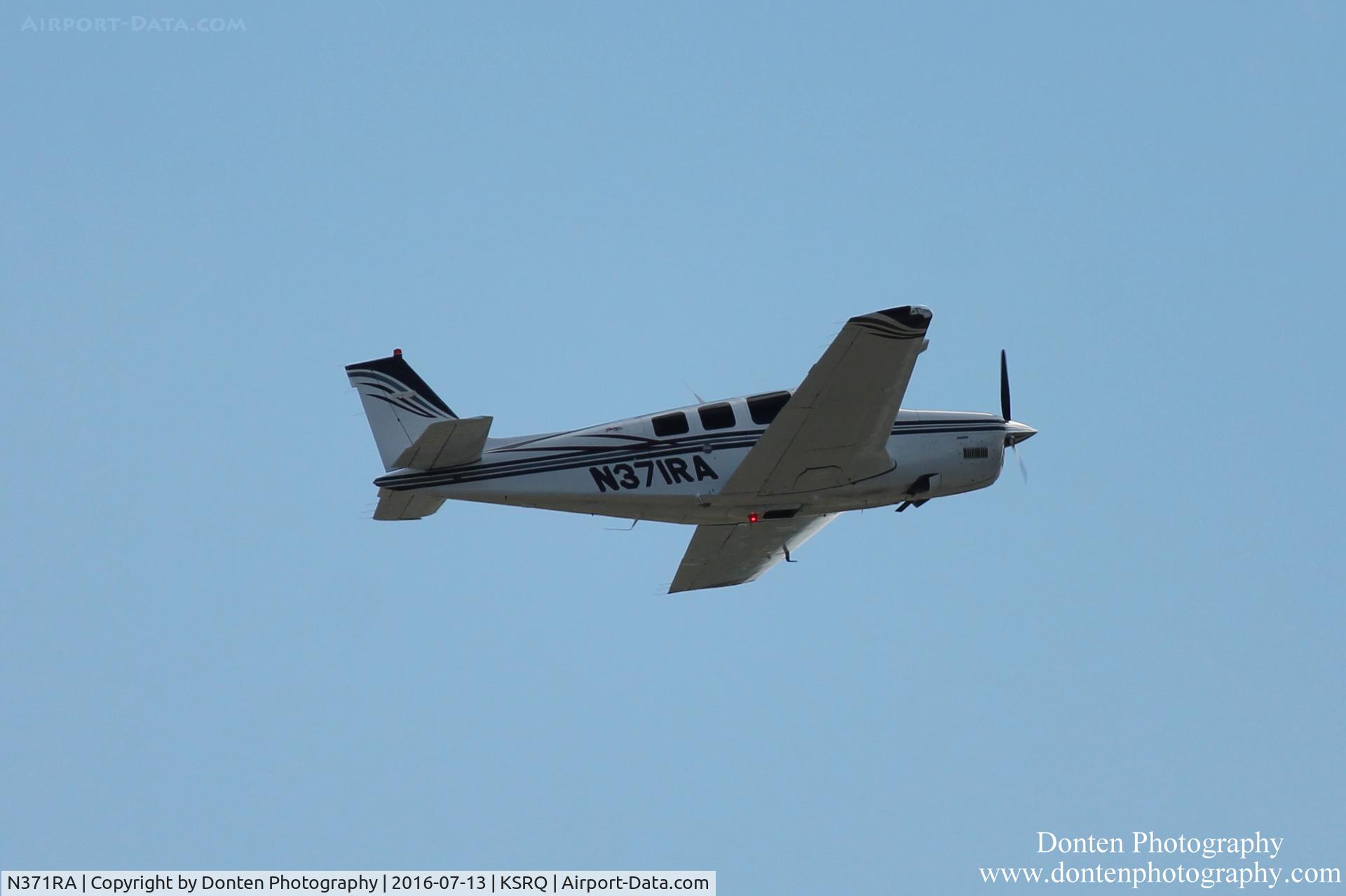 N371RA, Raytheon Aircraft Company A36 Bonanza C/N E-3590, Beechcraft Bonanza (N371RA) departs Sarasota-Bradenton International Airport