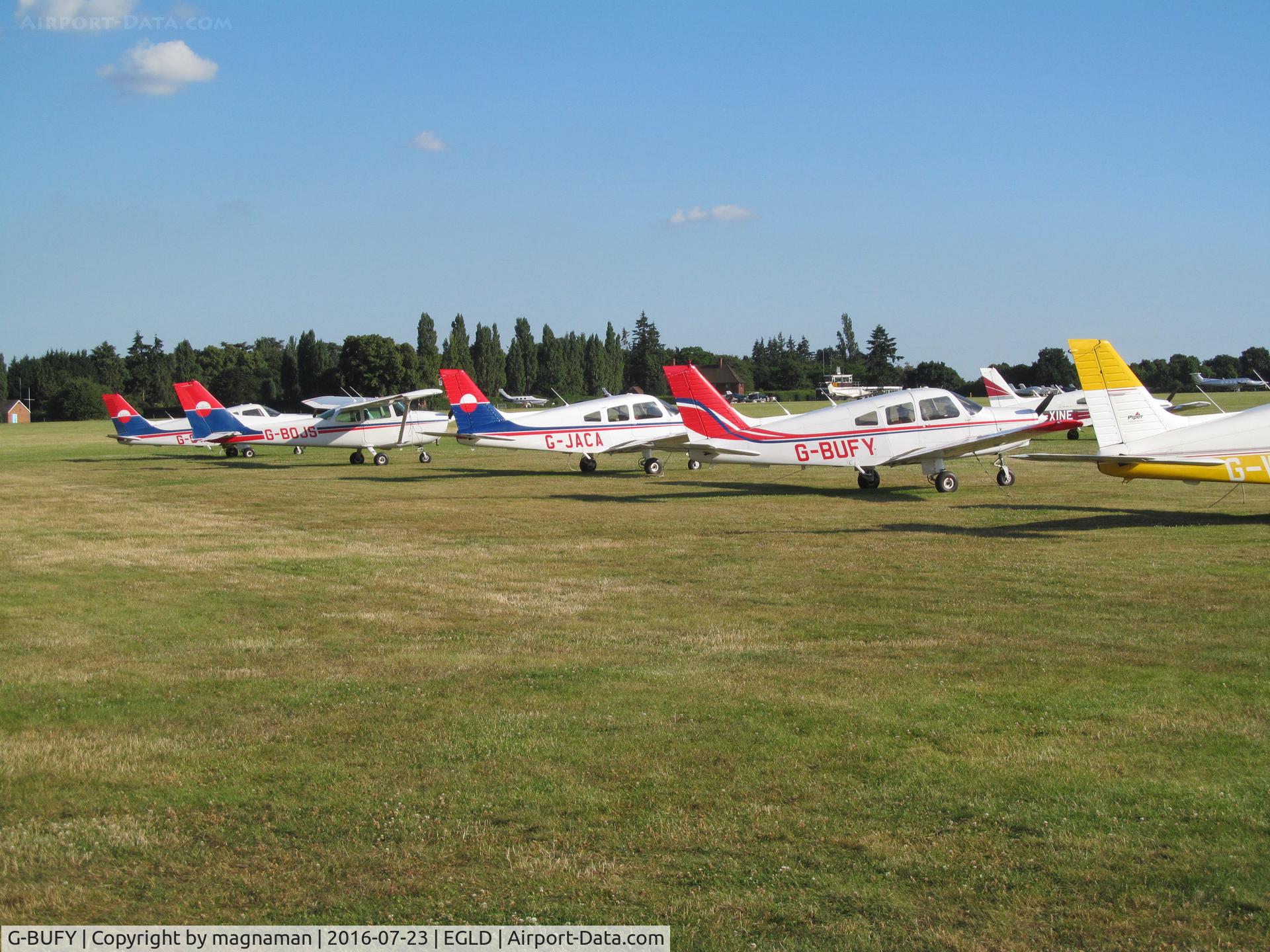 G-BUFY, 1980 Piper PA-28-161 Cherokee Warrior II C/N 28-8016211, among line ups of a/c at denham